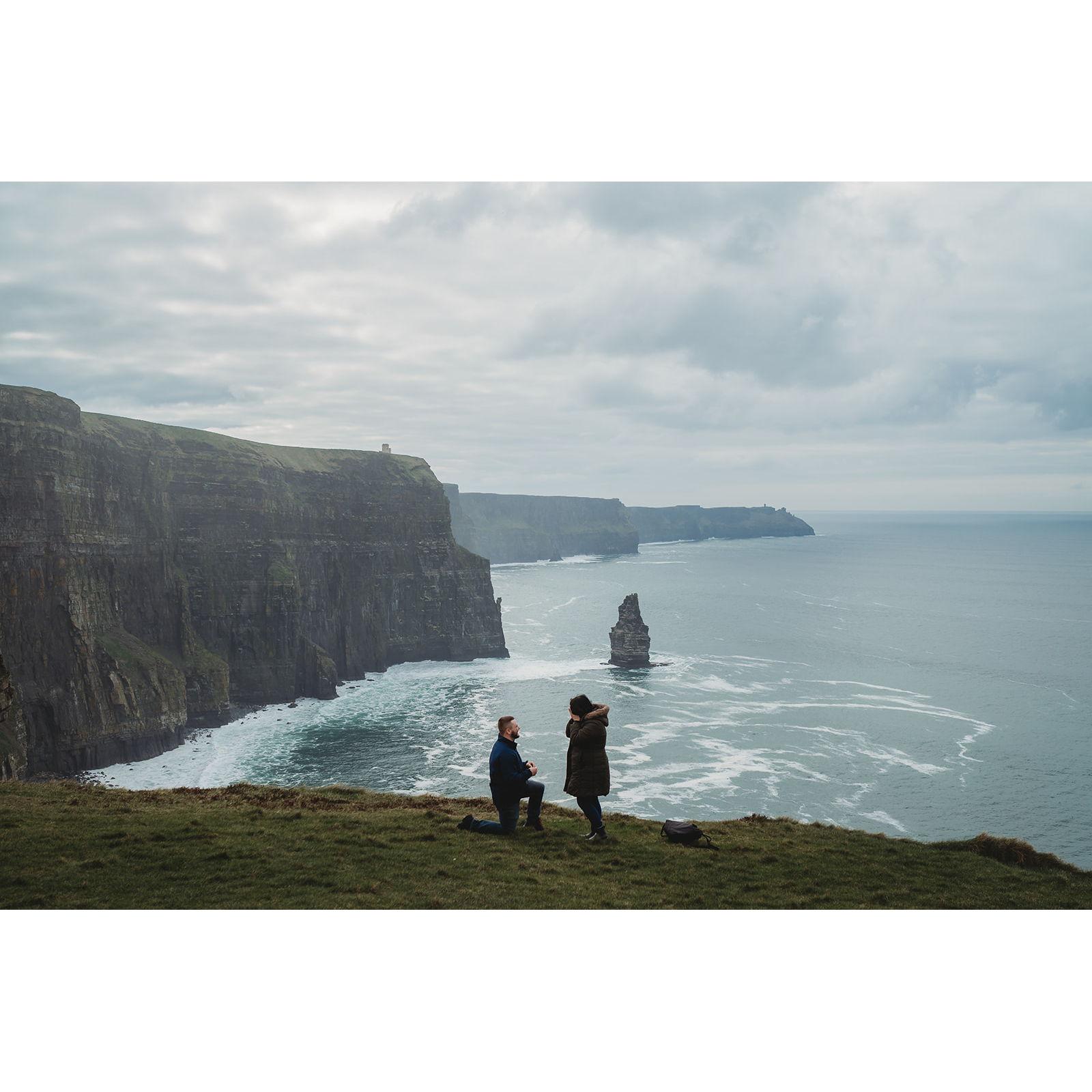 Cliffs of Moher in Ireland where we got engaged! Ryan surprised Rachel and had a photographer waiting to capture the beautiful proposal along with some engagement photos!