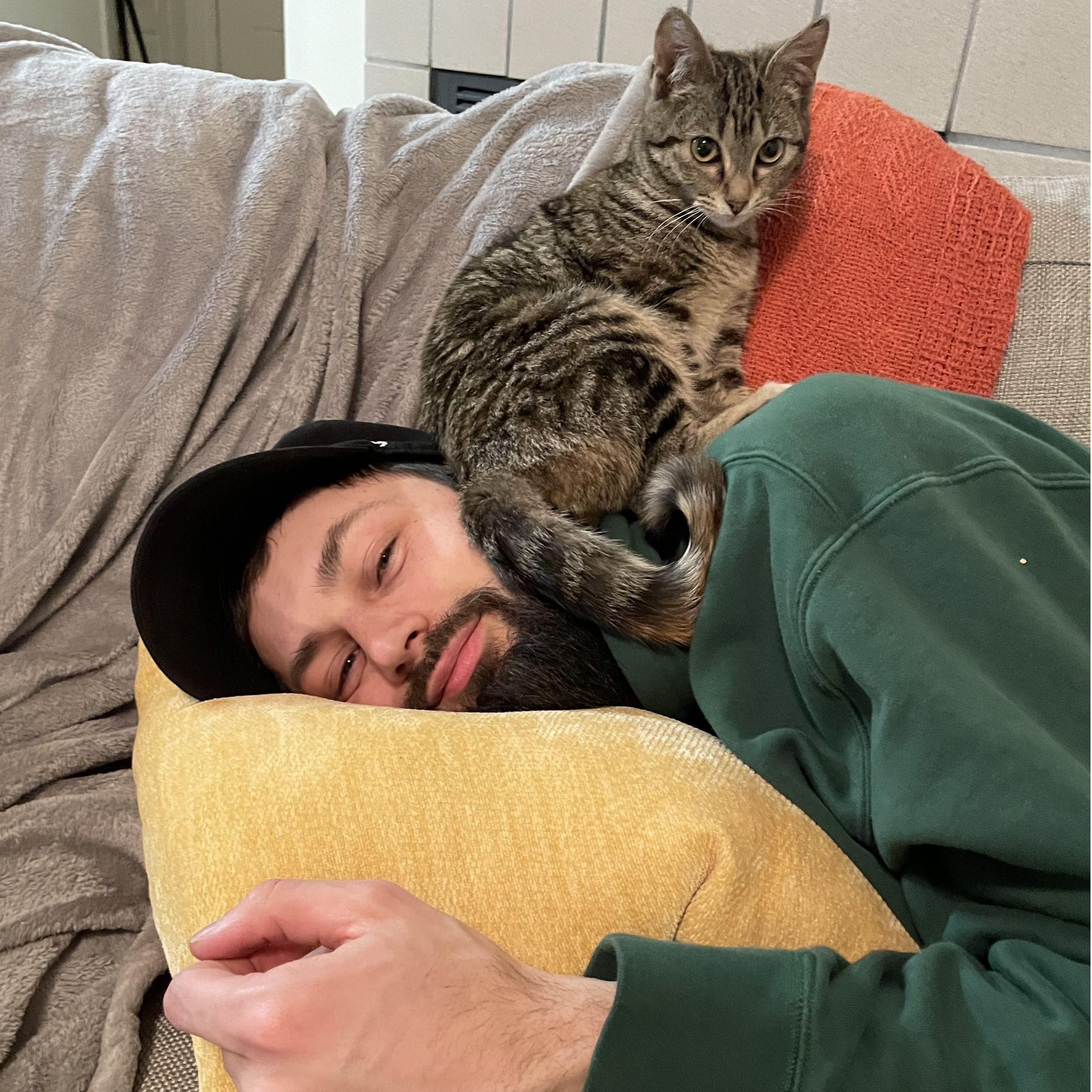 Leah sitting on Clint's head, February 2024
