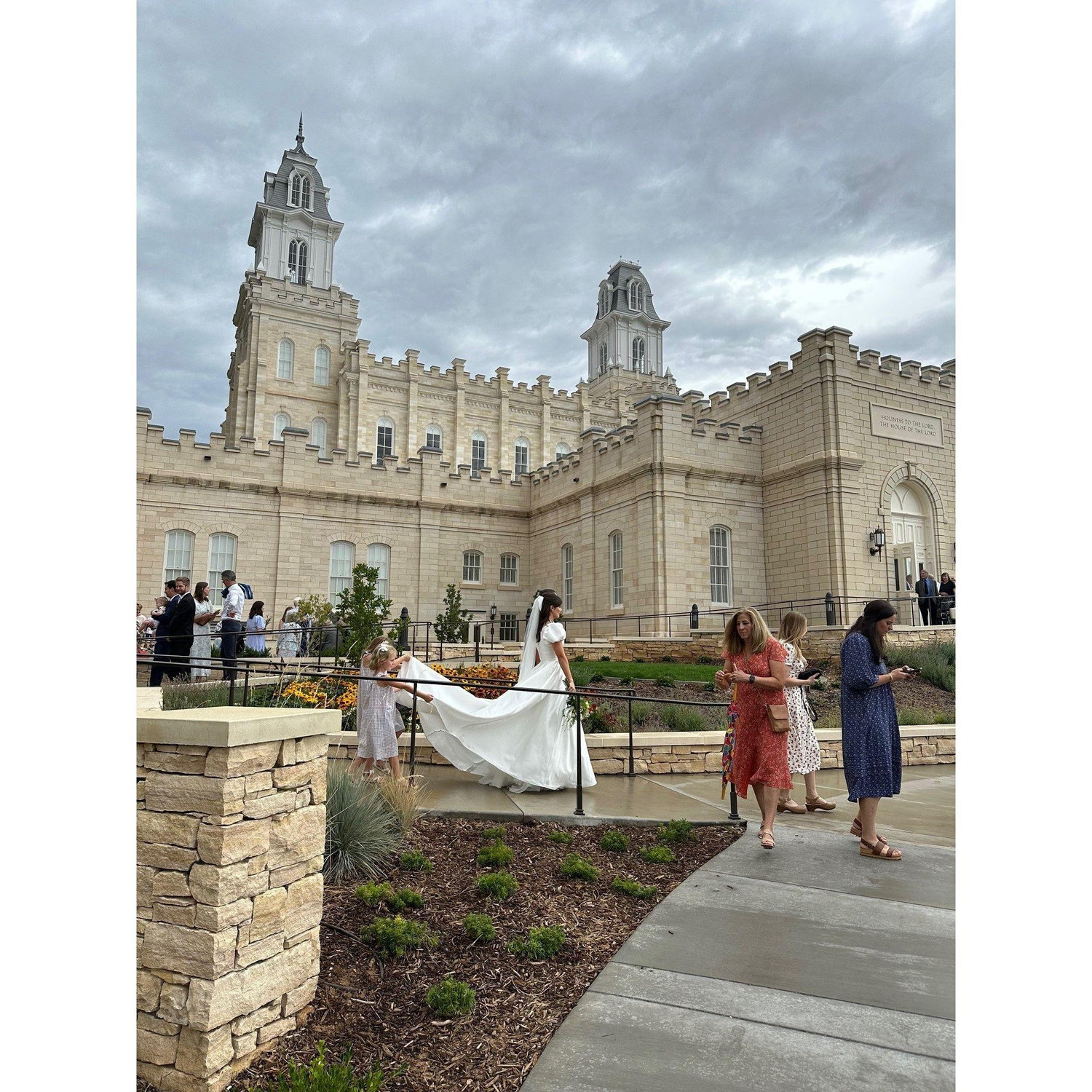 Luckily the rain stopped just as we left the temple!! Thank heavens for little flower girls who were eager to help with the train!