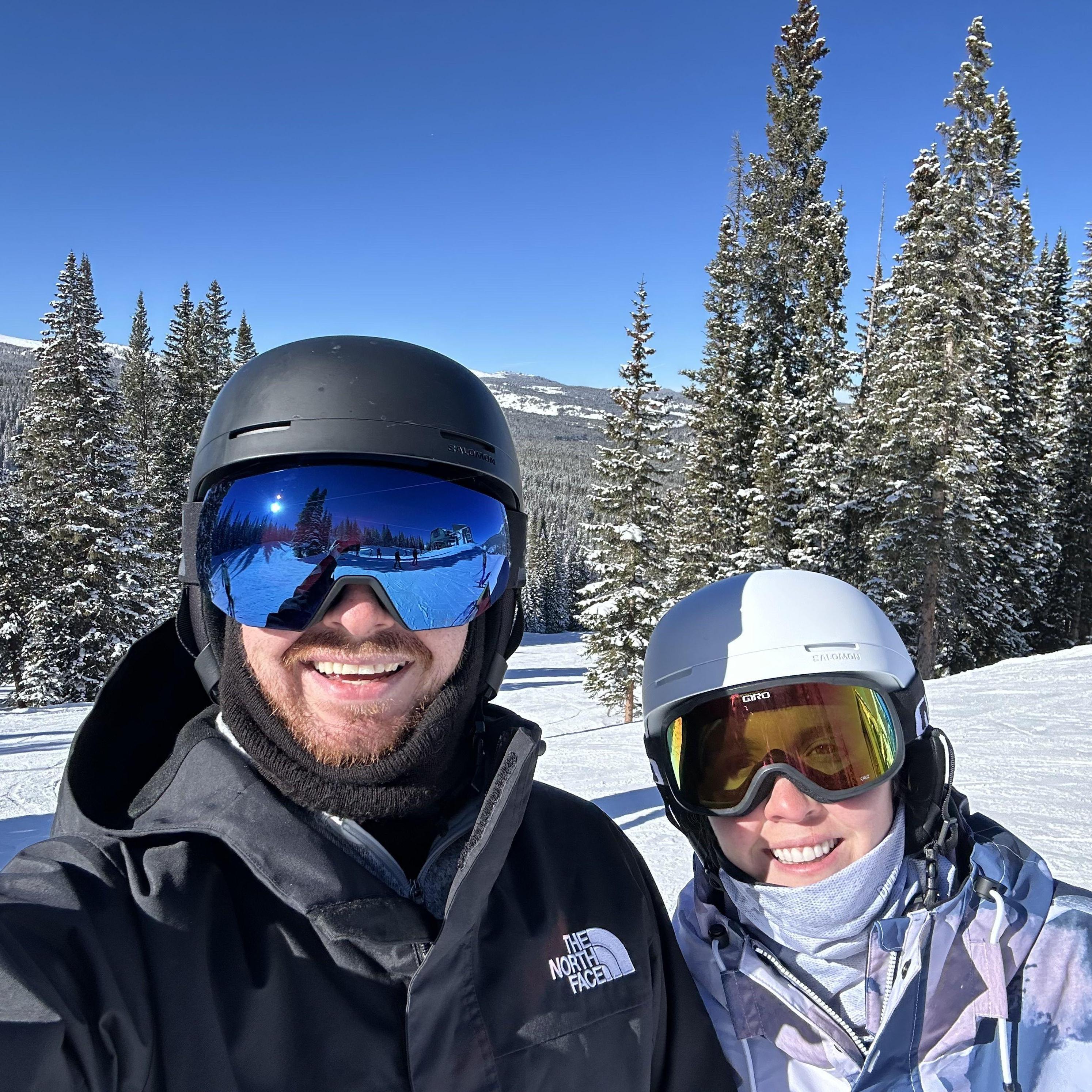 Andrew teaching Loren how to snowboard