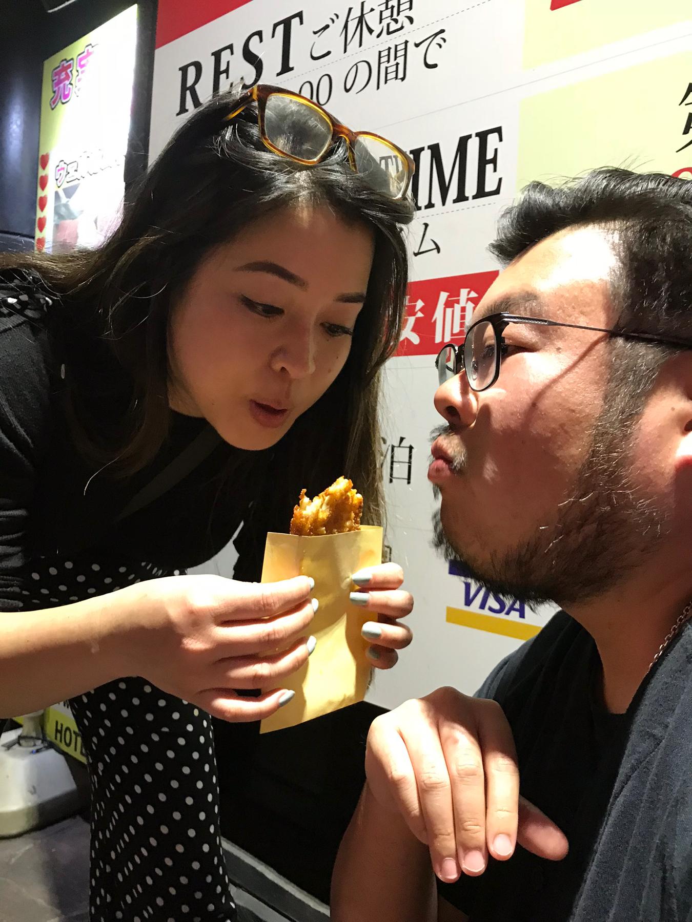 Sharing a gigantic fried thing after a club night in Japan