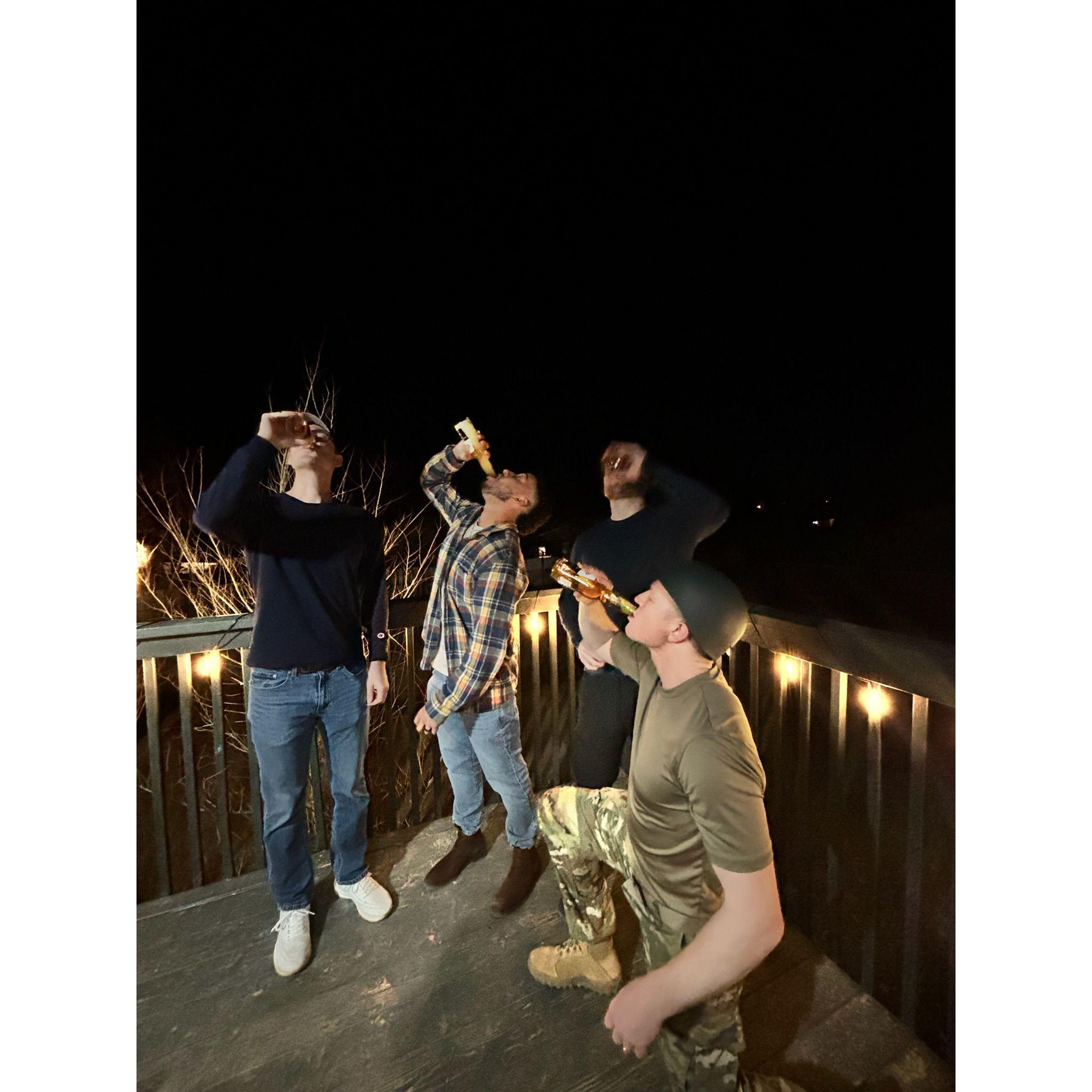Ryan and the guys chugging beers.