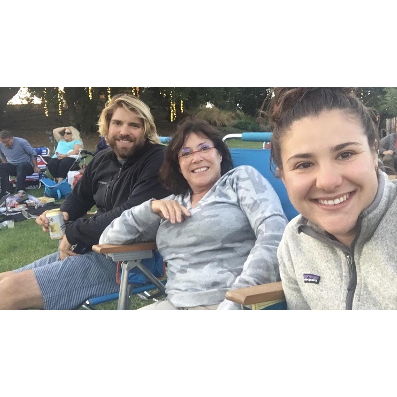 Walker, Karen (Francesca's Mom) and her listening to live music outdoors.
