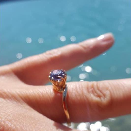 This ring! Chase looked at over 40 stones to pick the perfect shade. He chose a lavender sapphire, and it sparkles and shimmers gorgeously. Leslie's finger has never looked so good. :)
