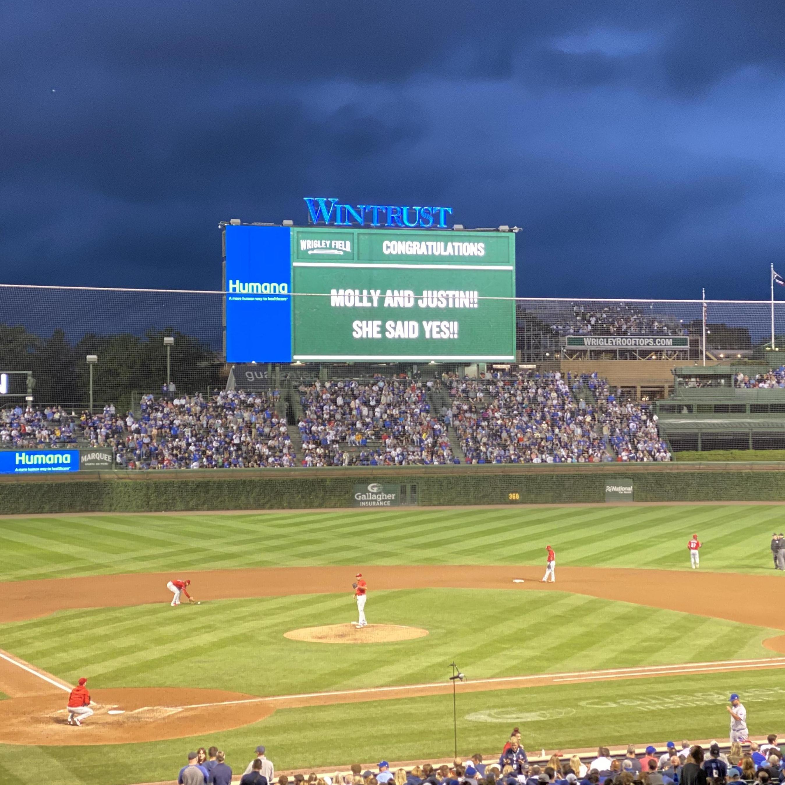 Engagement announcement at the Cubs Game, She said Yes!