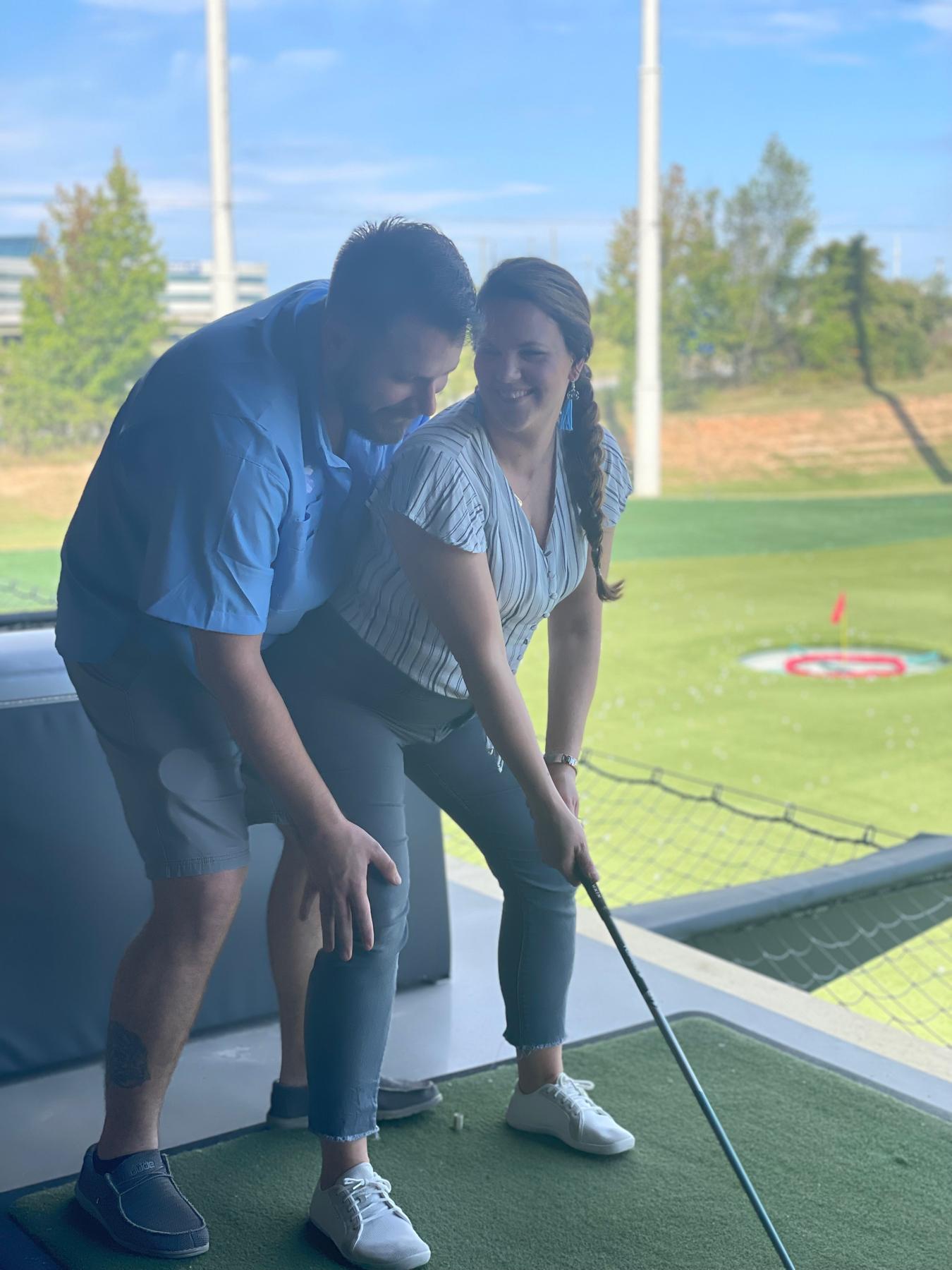 Lance is 30! And trying to teach Shae proper form for golf.