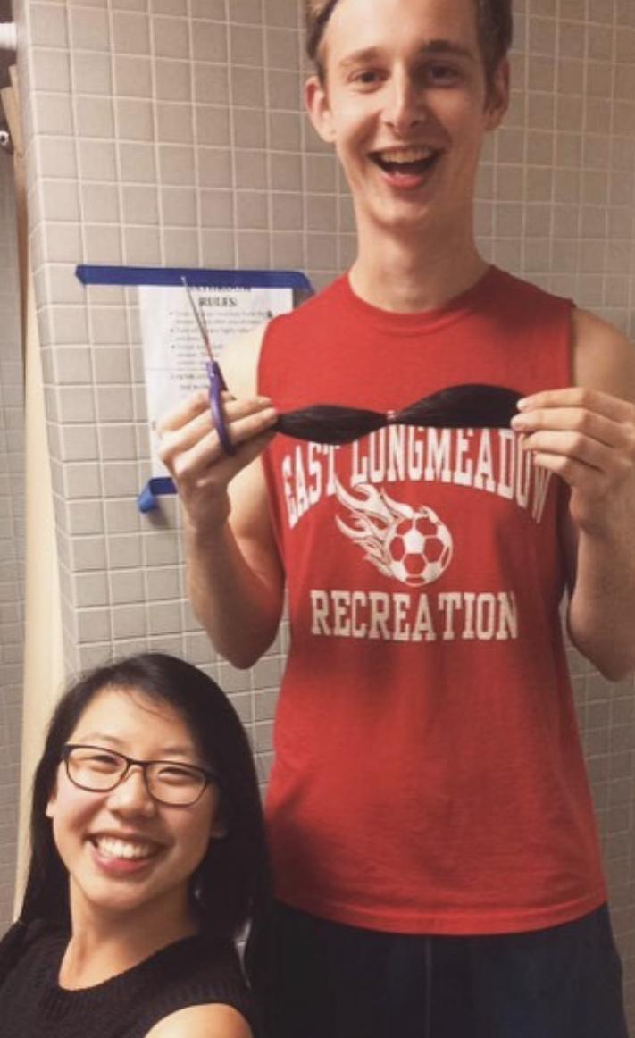 Mike cutting Kaitlin’s hair in a college dorm after she lost a bet. Ah the blunder years :)