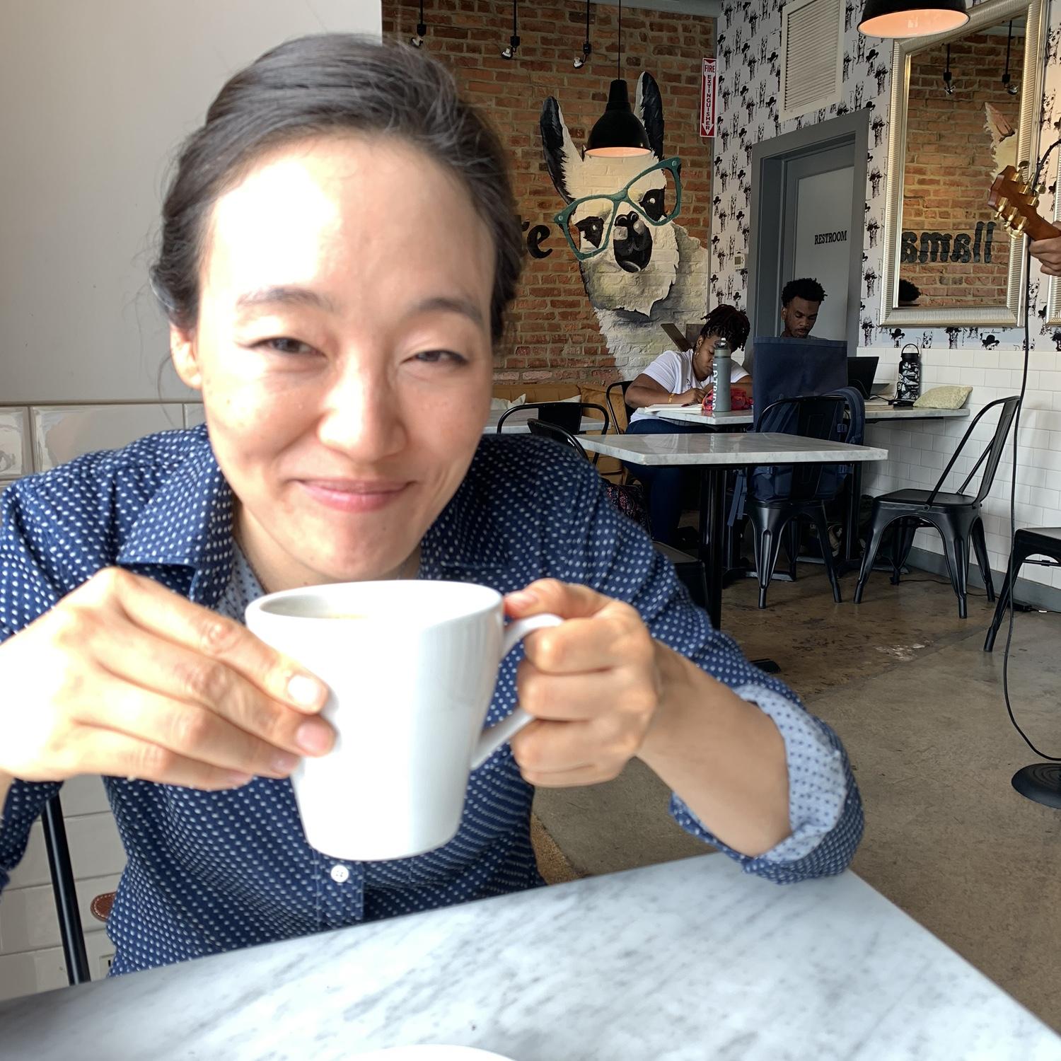 ...and stealing sips of his mostly cream-filled coffee..