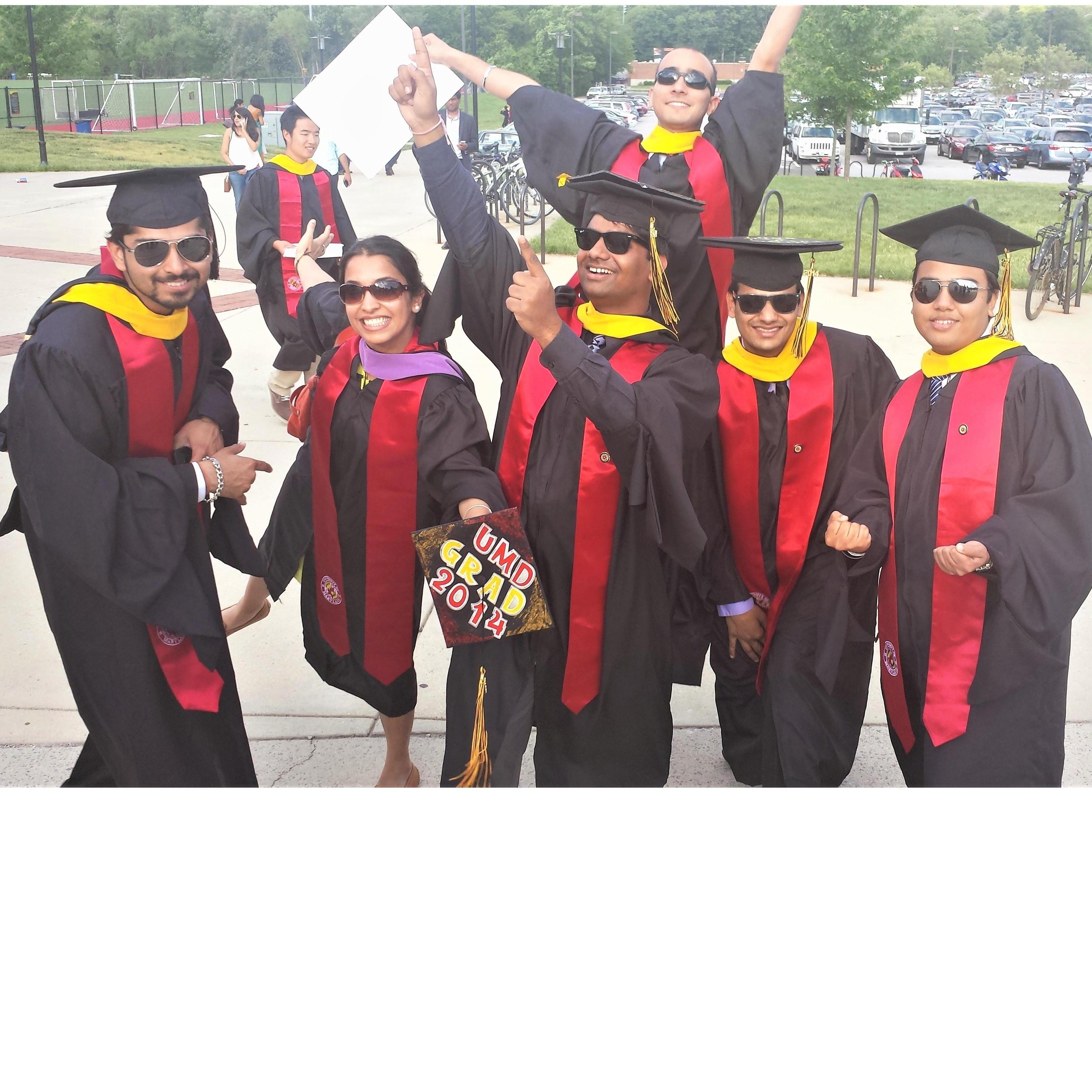 Posing for our graduation with all our friends.