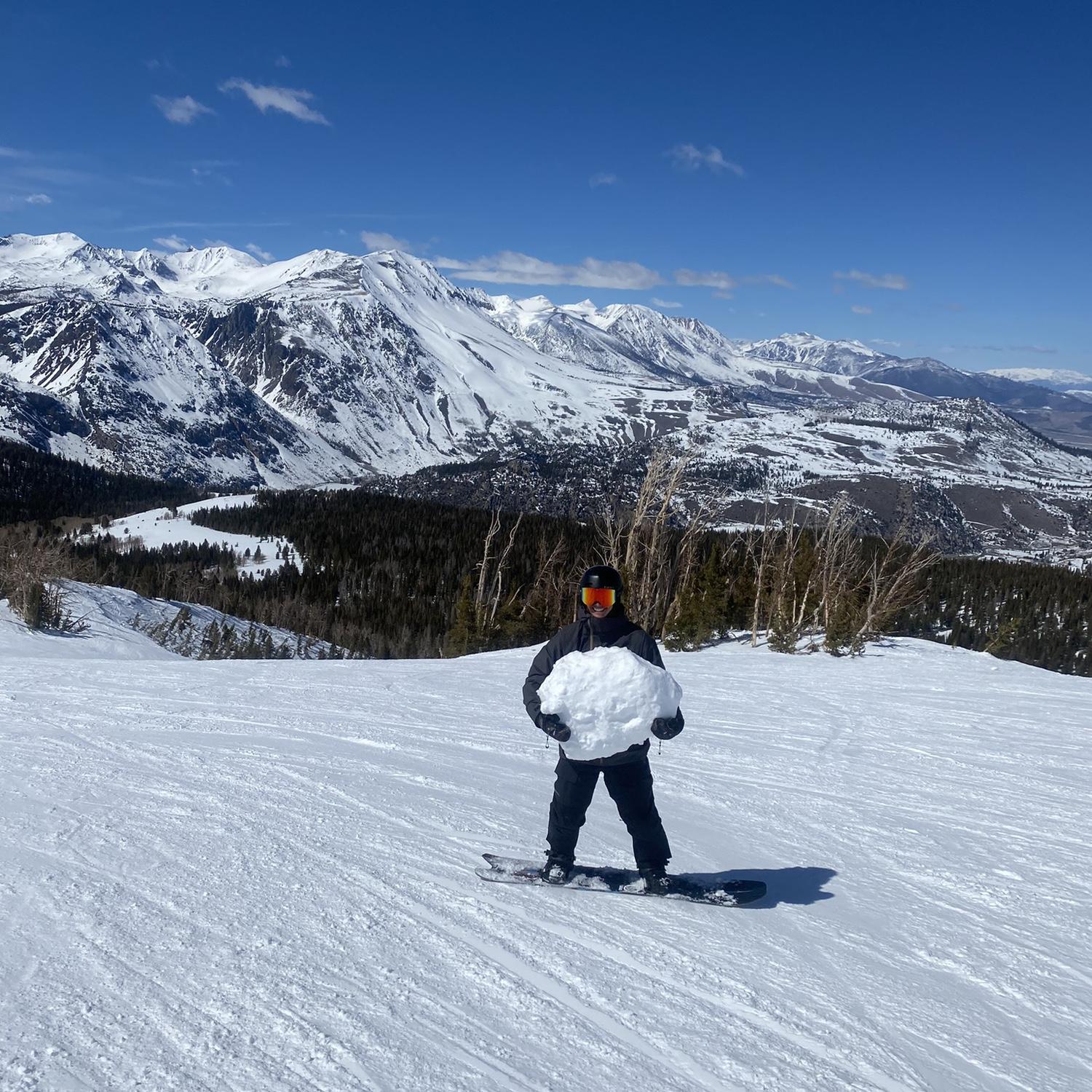 Trent riding with a giant snowball