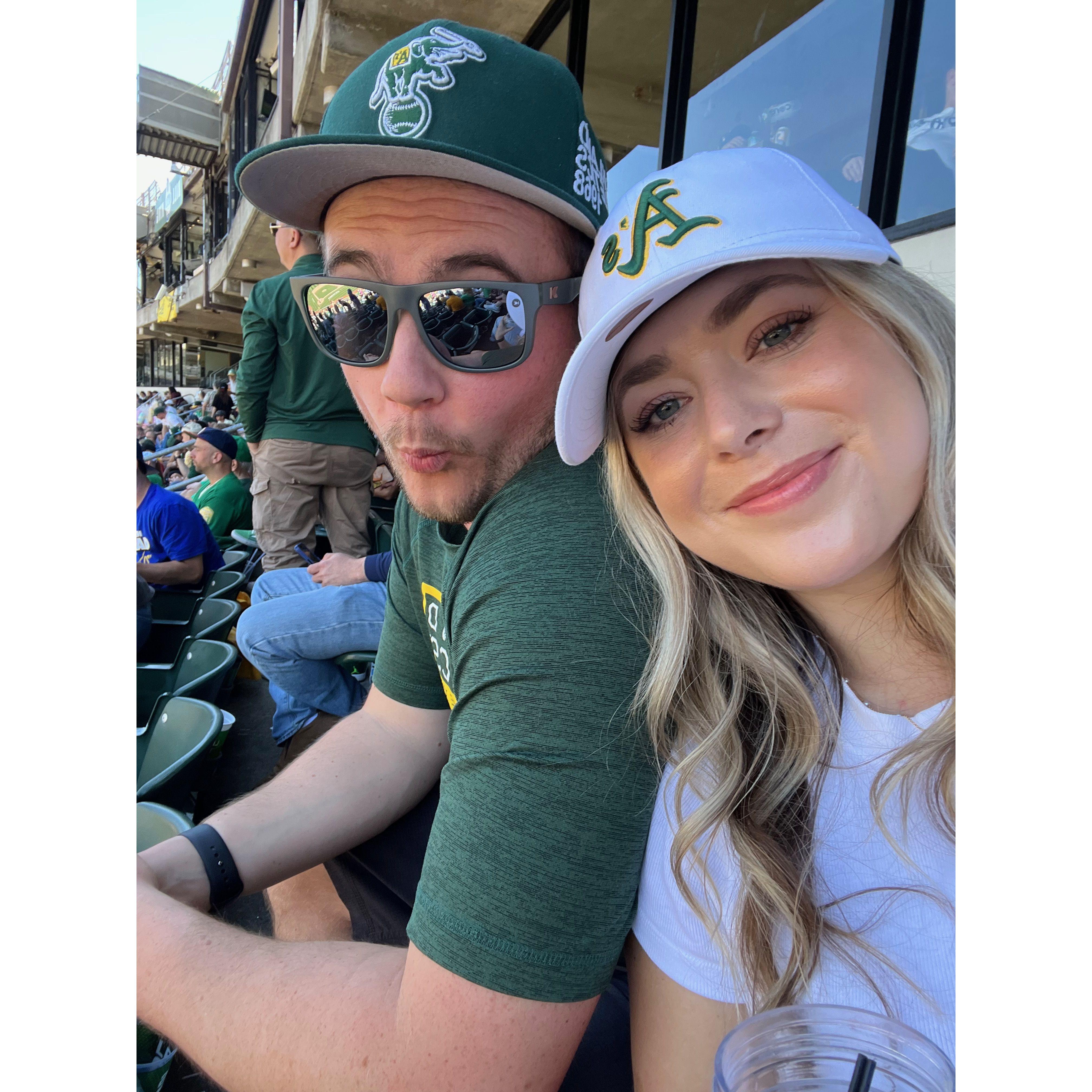 Slowly making Kayla an A's fan. It starts with a hat.