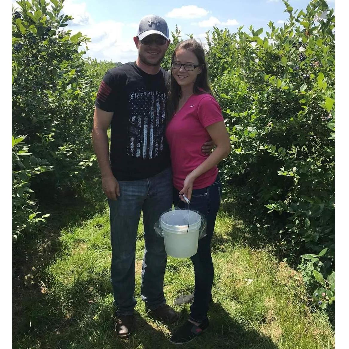 Bekah's first trip to Michigan, picking blue berries at the blue Berry Farm.