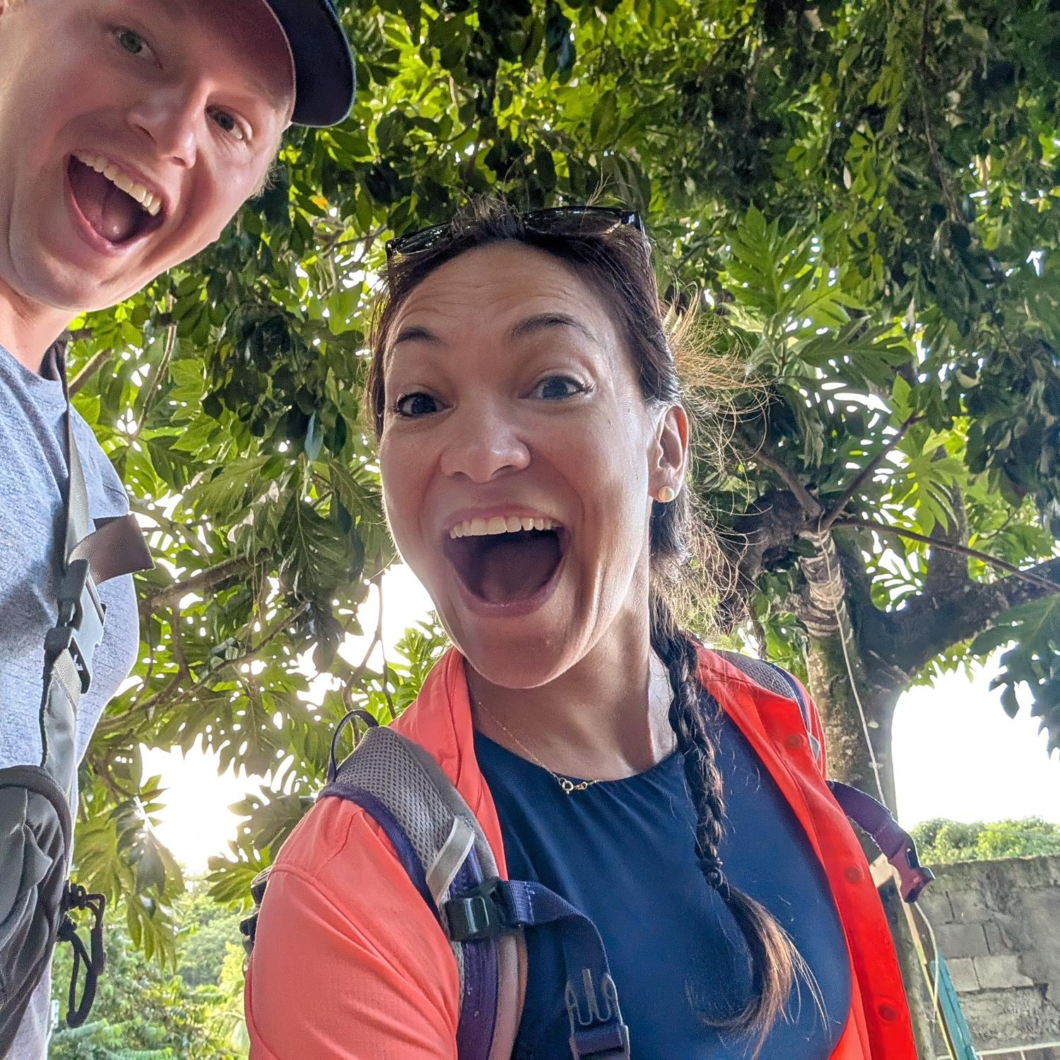 Hiking / climbing / scaling the Gros Piton peak! (She doesn’t know the ring is in the fanny pack…)
