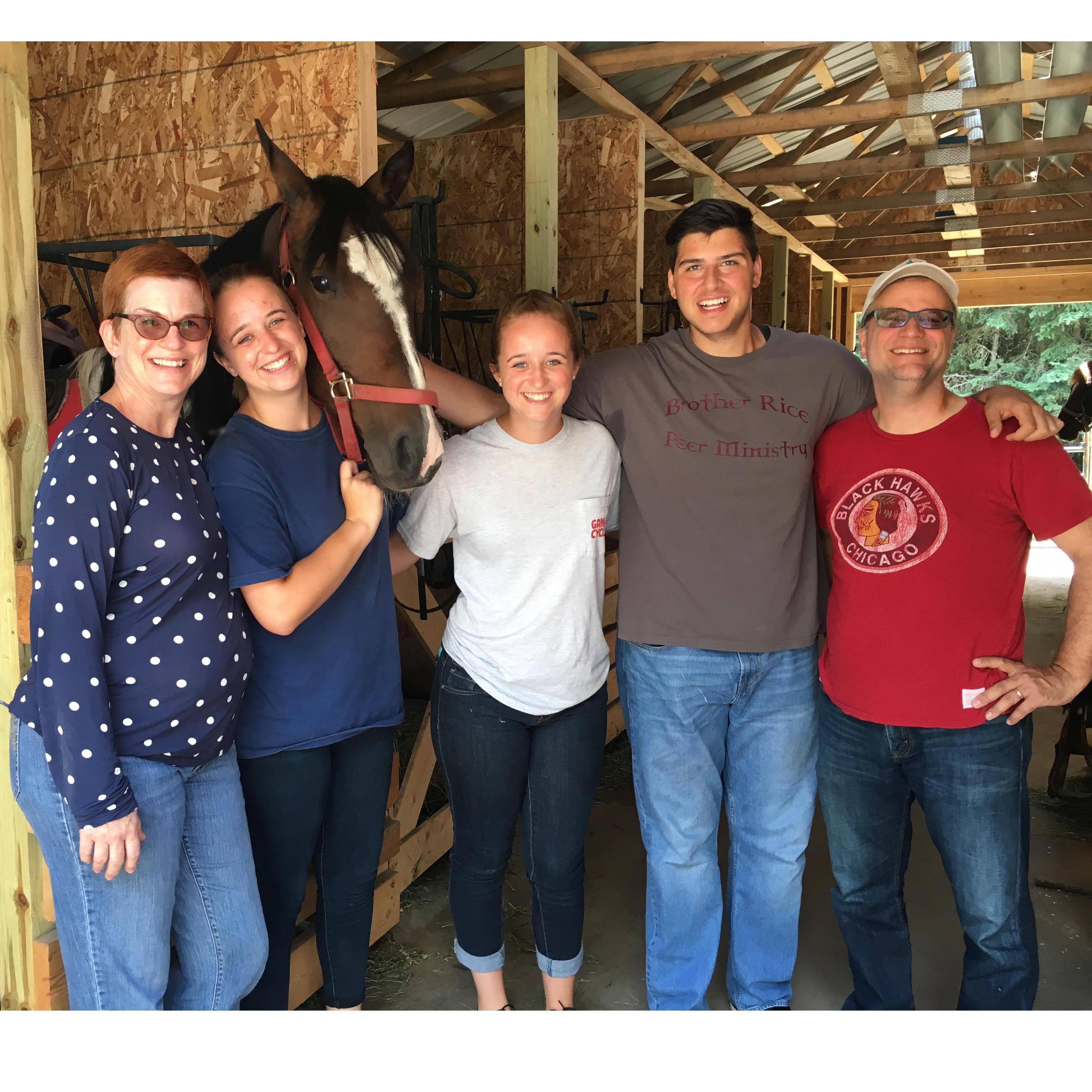 Family horseback riding near Big Sand Lake Club