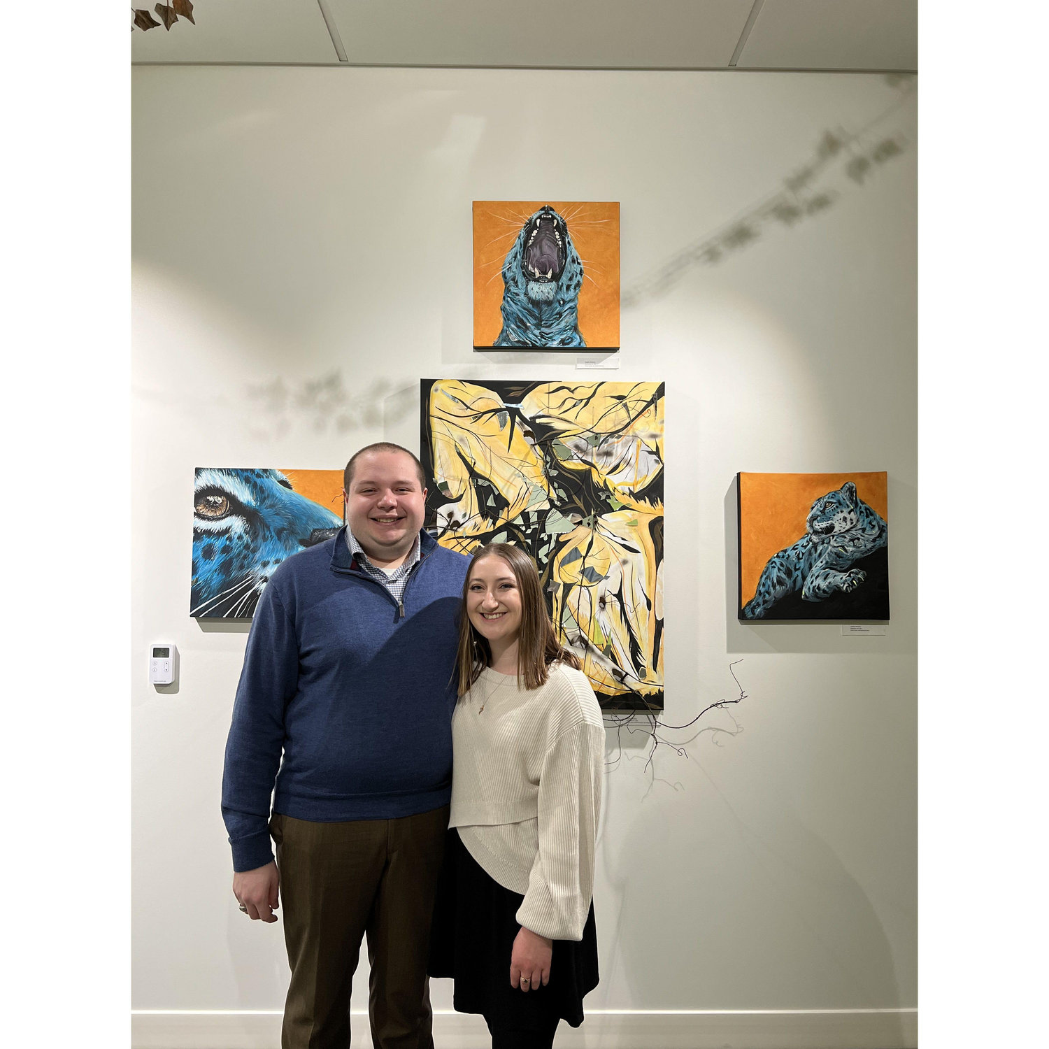 Matt and I standing in front of Angela's senior exhibition project in Spring 2022.