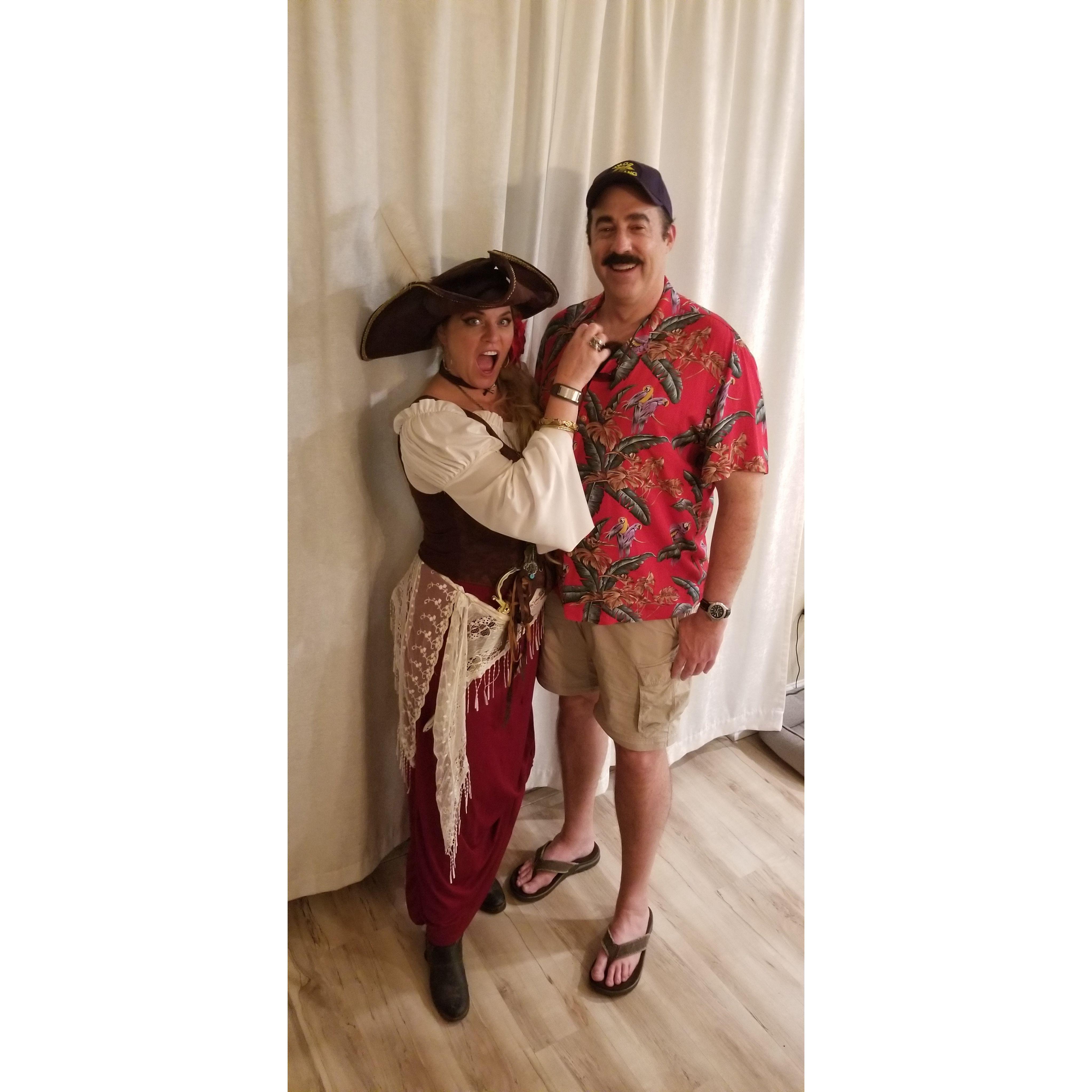 What's a 'meet-cute'? It's when a 1680s Privateer meets a 1980s Private-Eye on Halloween! Russ and Aida may not always coordinate on costumes, but they always sync up on humor!
