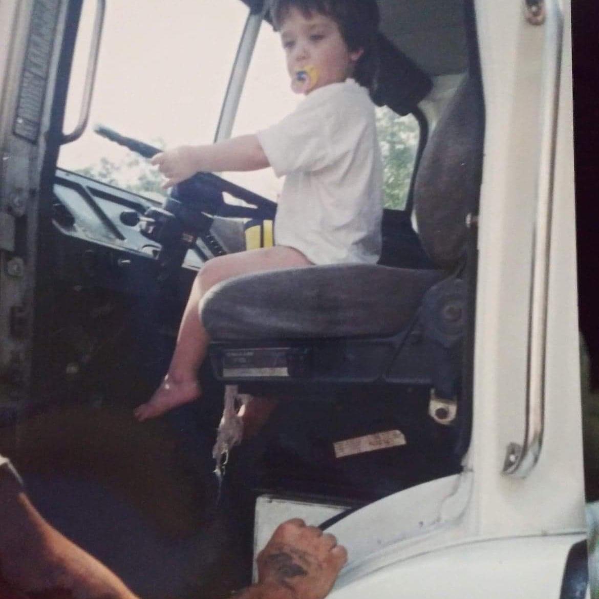 Throwback! Eric taking a ride in the Semi! I swear he never had pants on lol! Aint he cute!