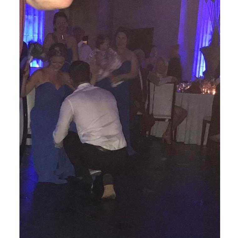 Hard to see, but this is us at the wedding with the “you’re next” garter!