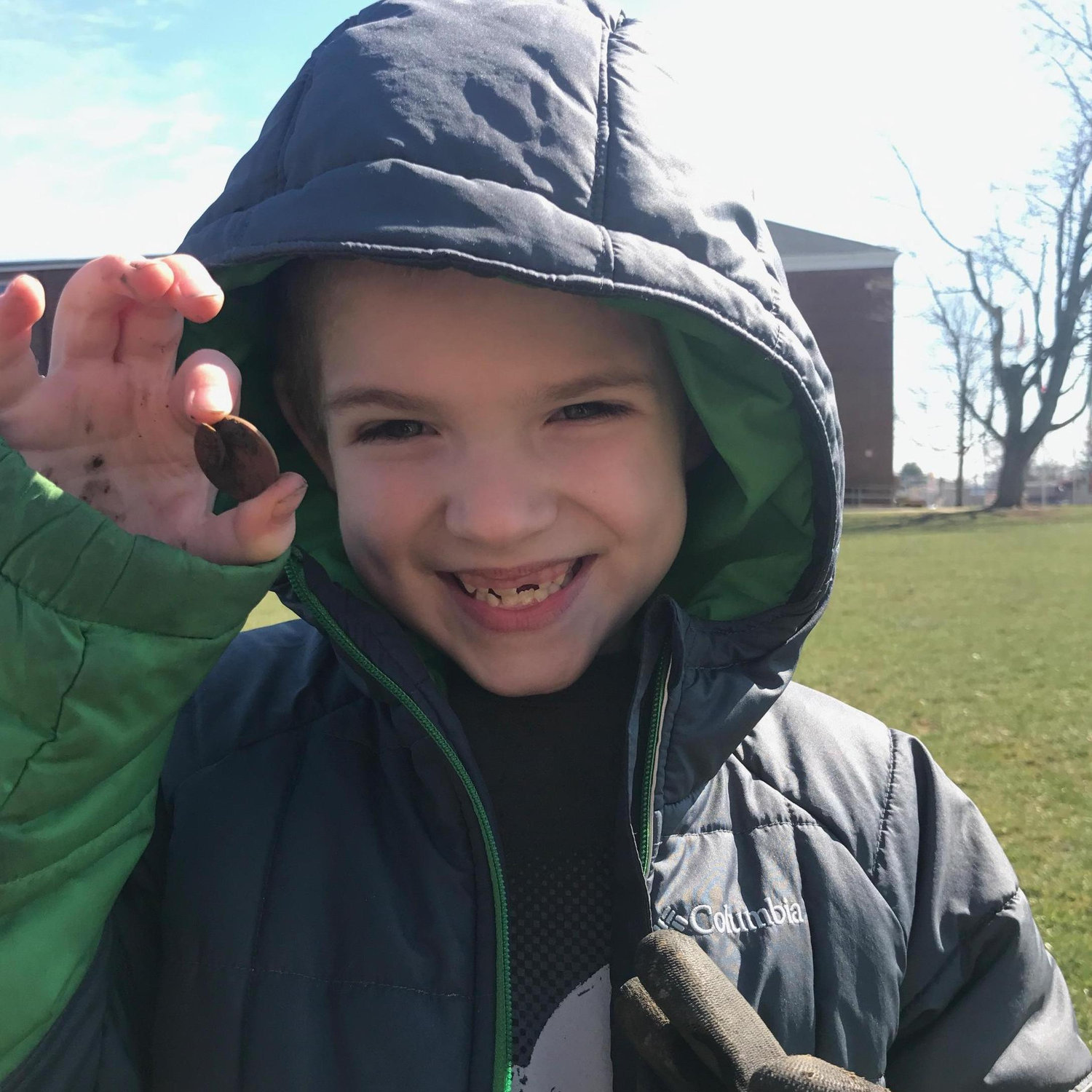 Finding his first coin metal detecting with daddy.