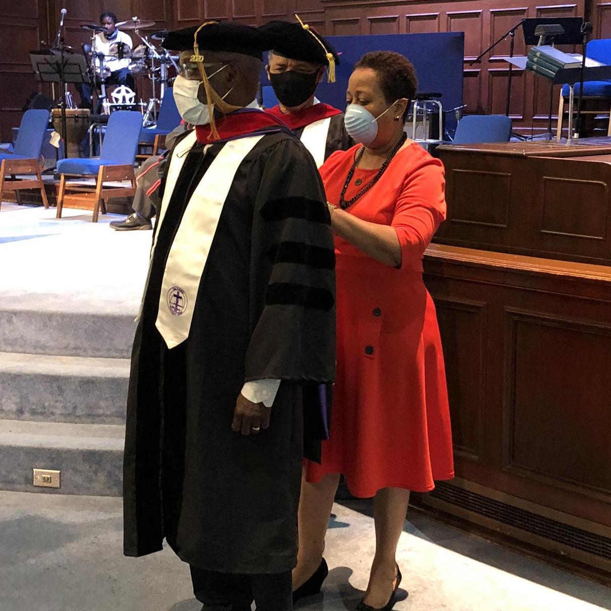 Deneese assists with Stephen’s honorary doctorate of divinity hooding ceremony during the COVID pandemic.