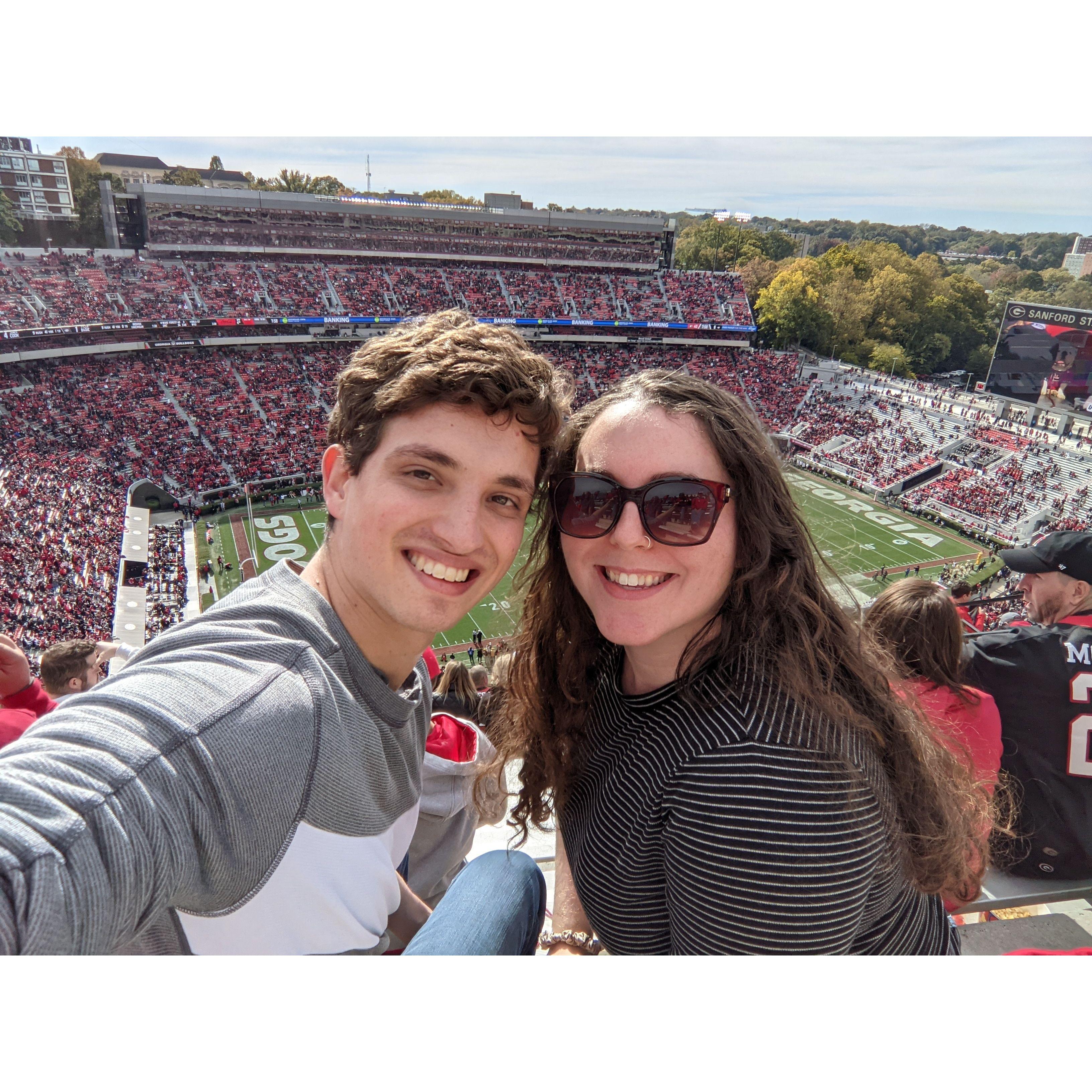 Allie dragging Christian to a UGA Football game