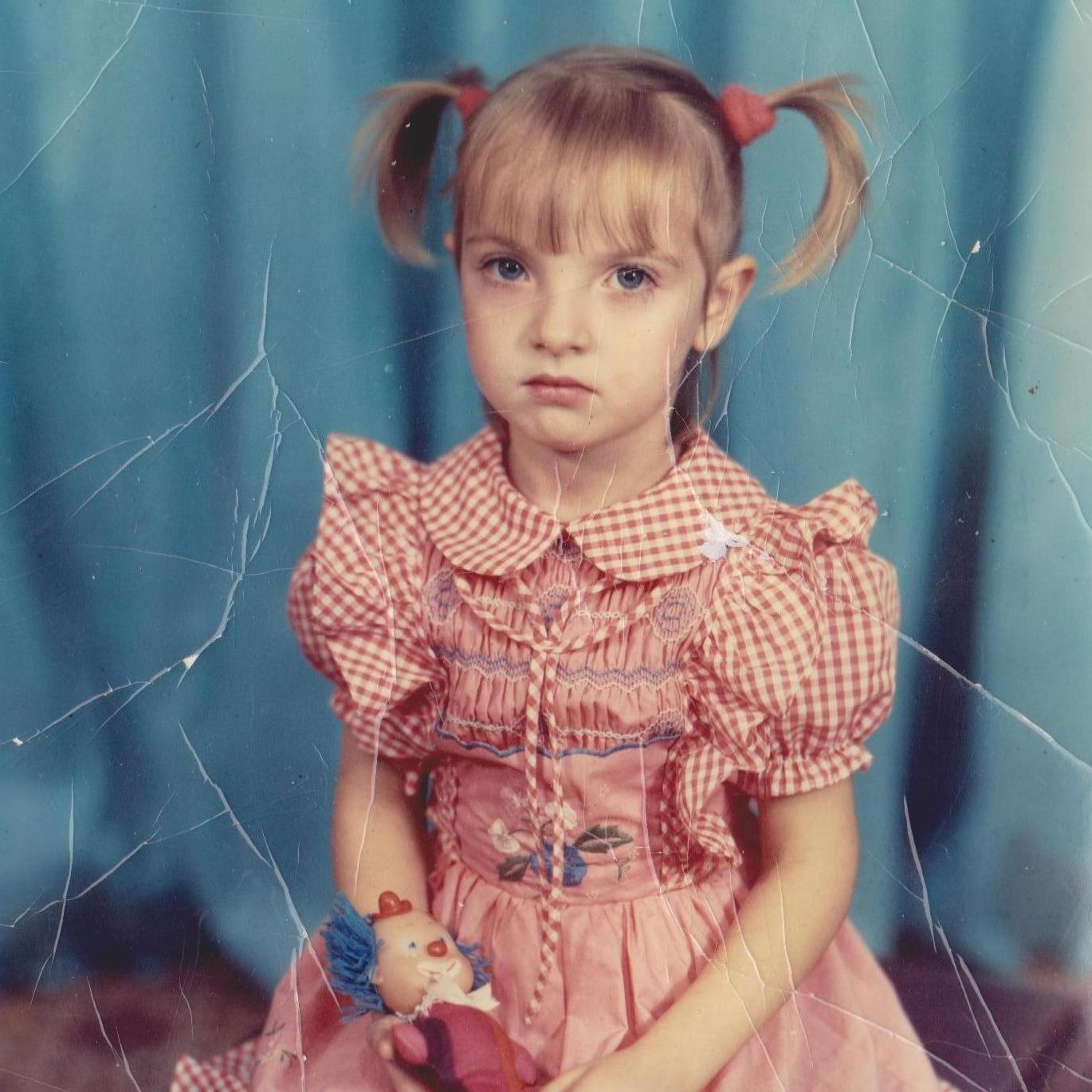 Yulia is 4, she already likes to match her socks and her pigtails to the color of the dress... you know, fashion.