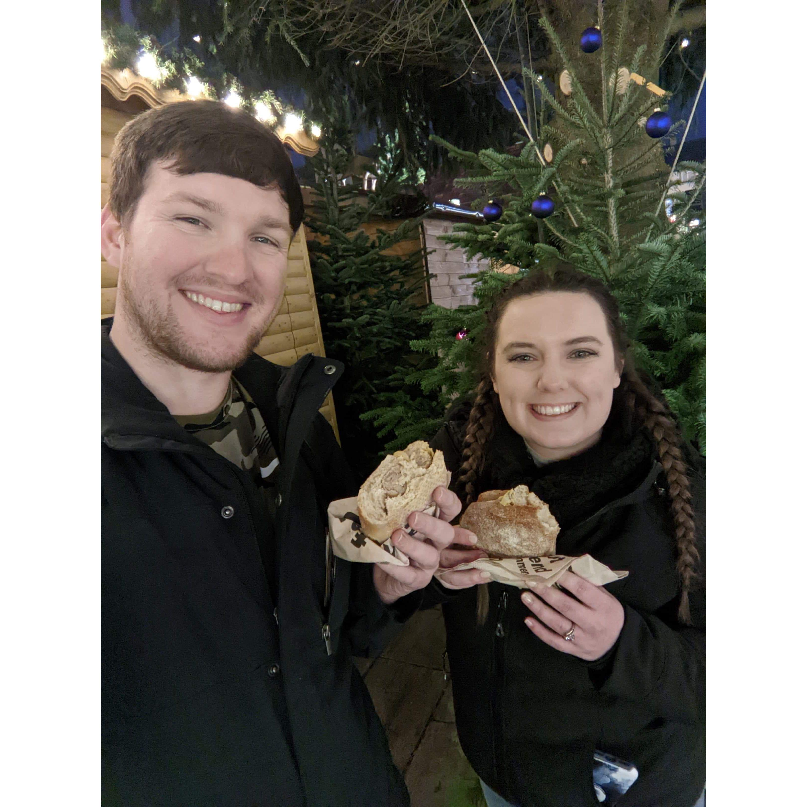 Newly engaged munching on some brats (?) (Wurzburg, Germany)