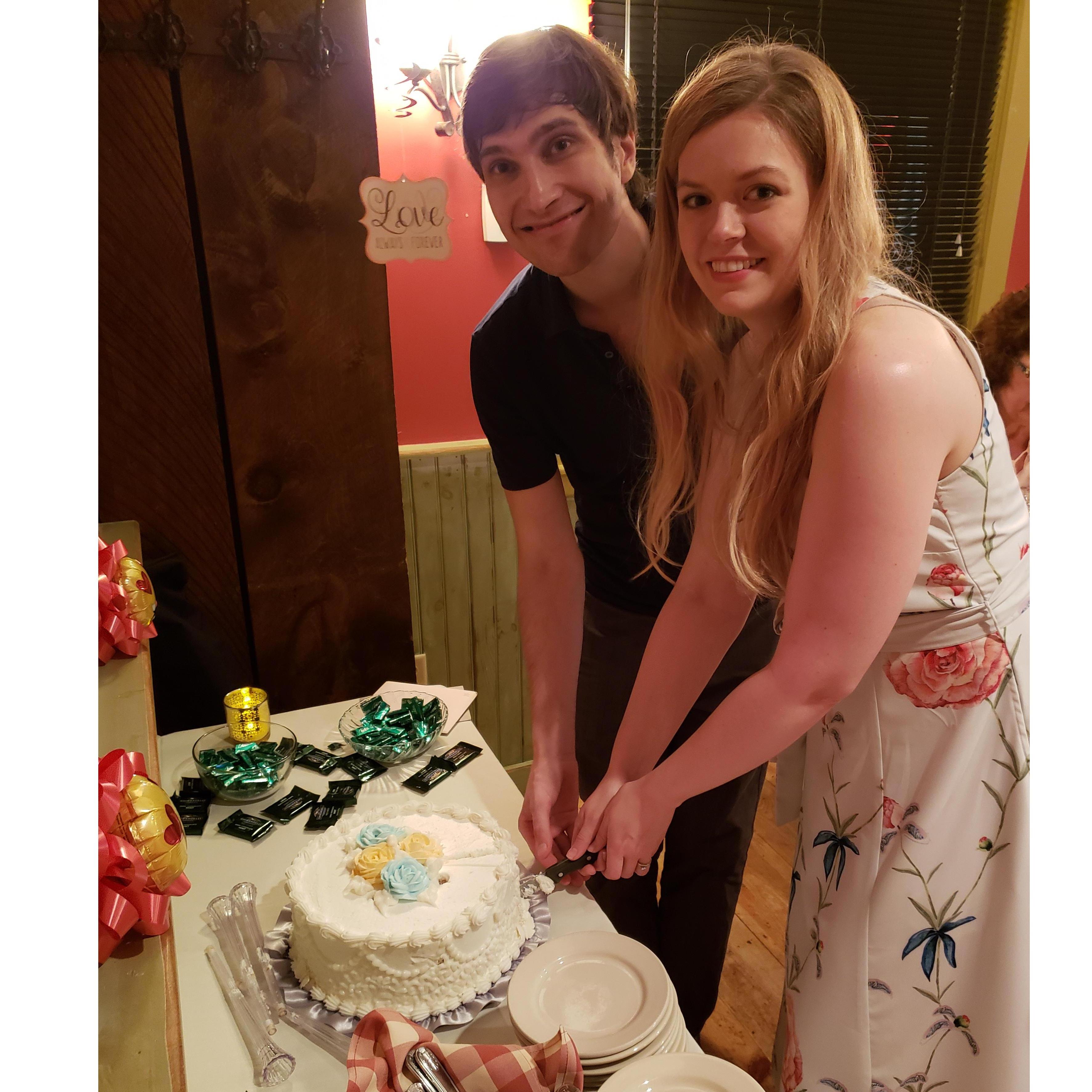Practicing our couple's cake cutting at the NH engagement party