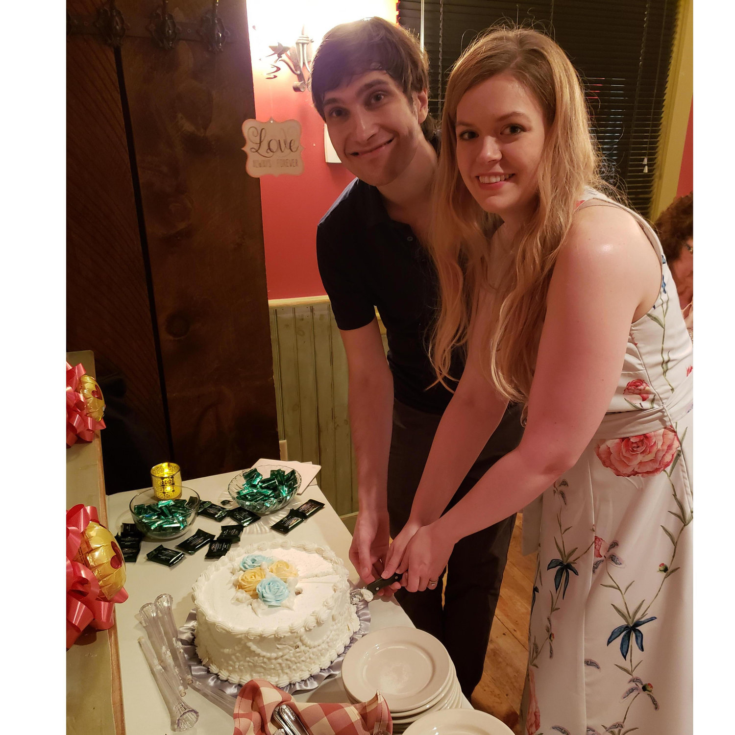 Practicing our couple's cake cutting at the NH engagement party