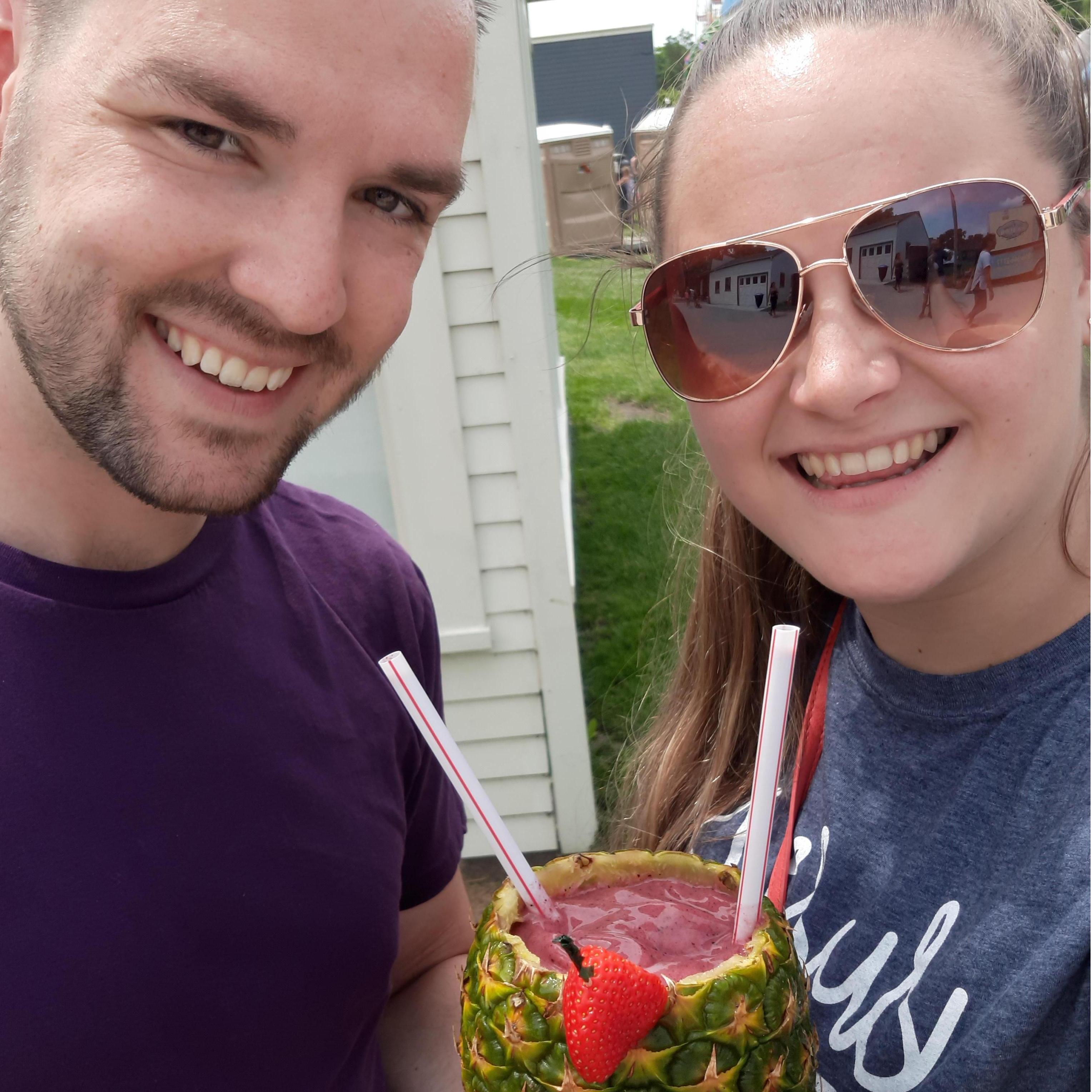 Downtown Shawnee summer fair with a smoothie in a pineapple.