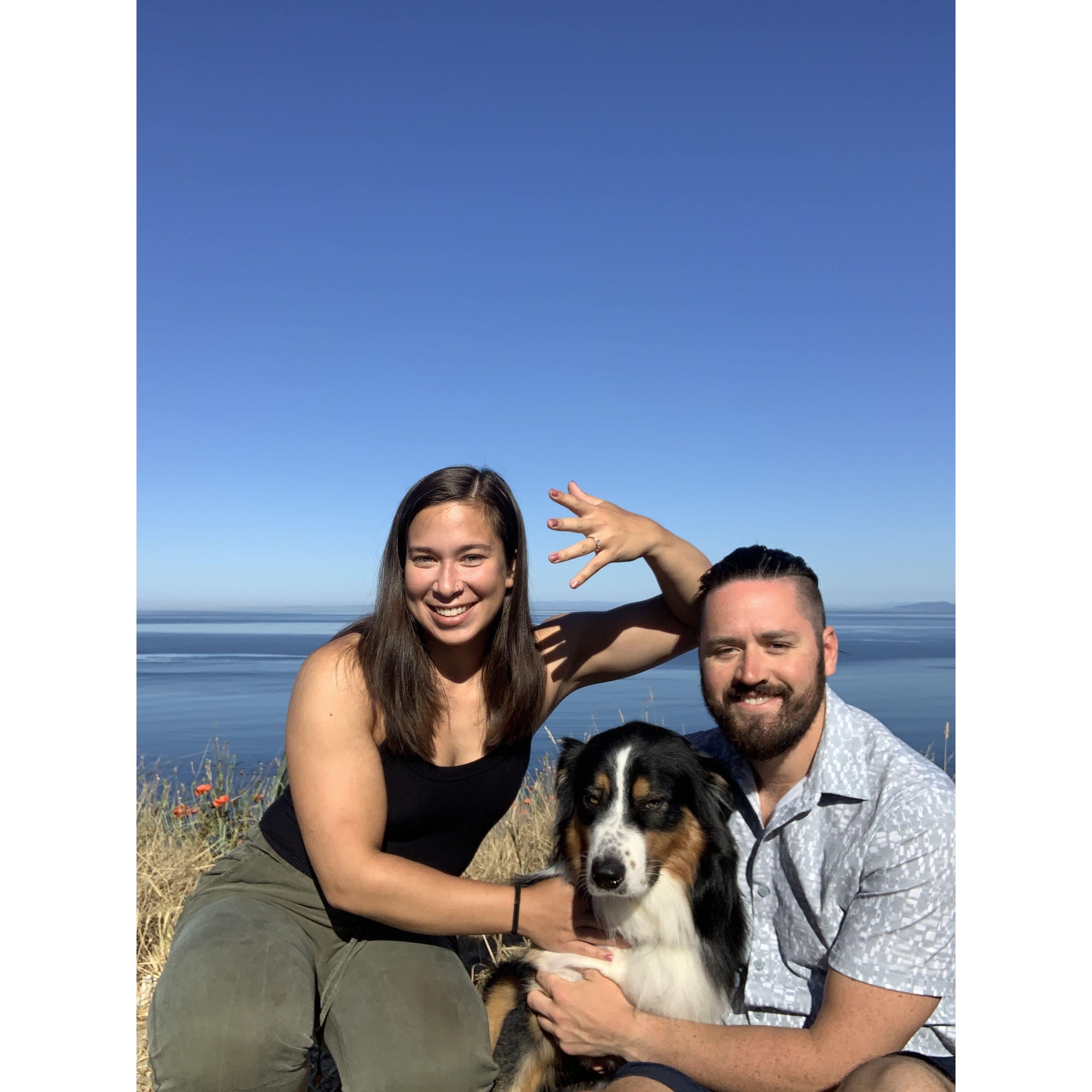 Our first photo after getting engaged; Murray participating against his will