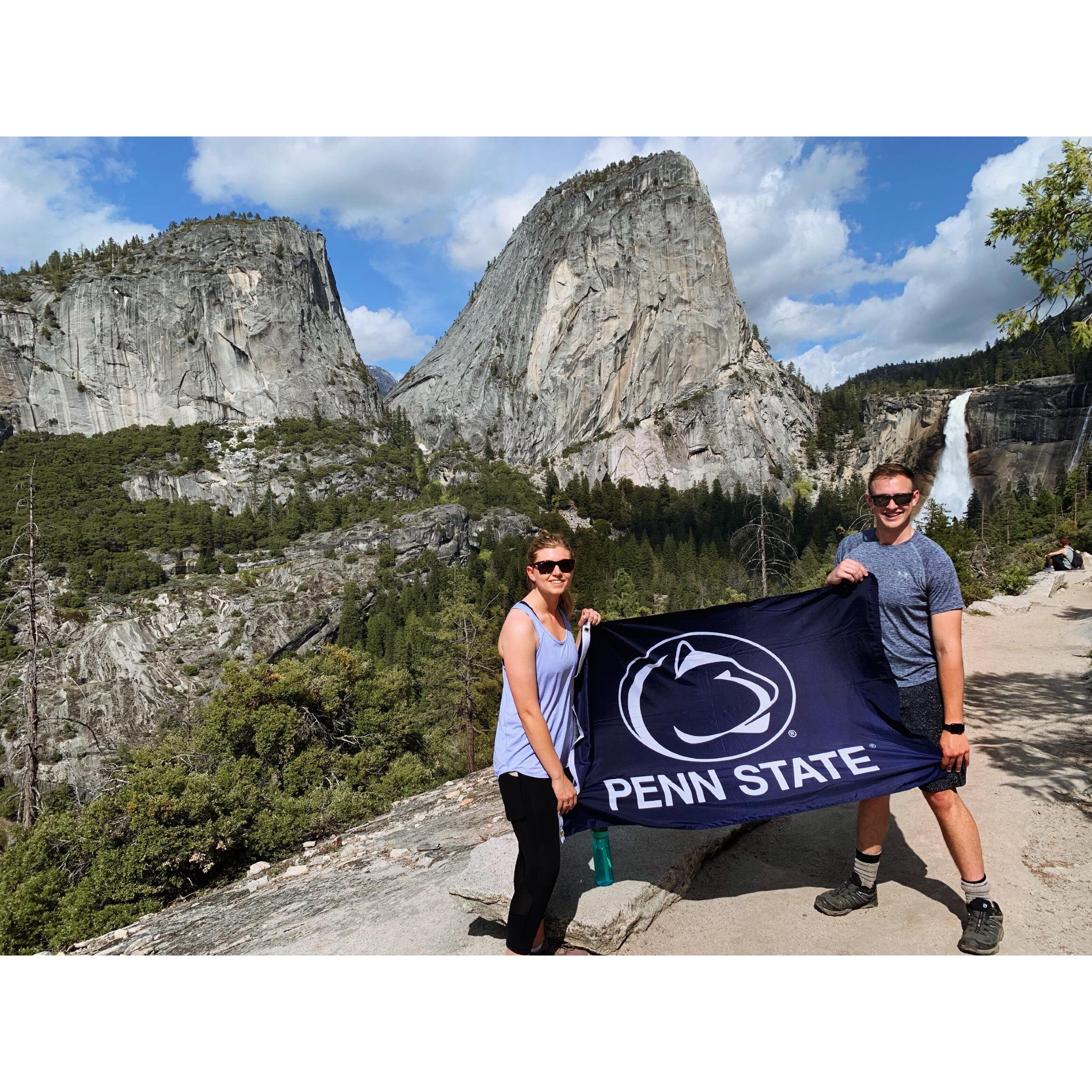 After Peter proposed, on our hike back, we had to get a photo with our Alma Mater flag!