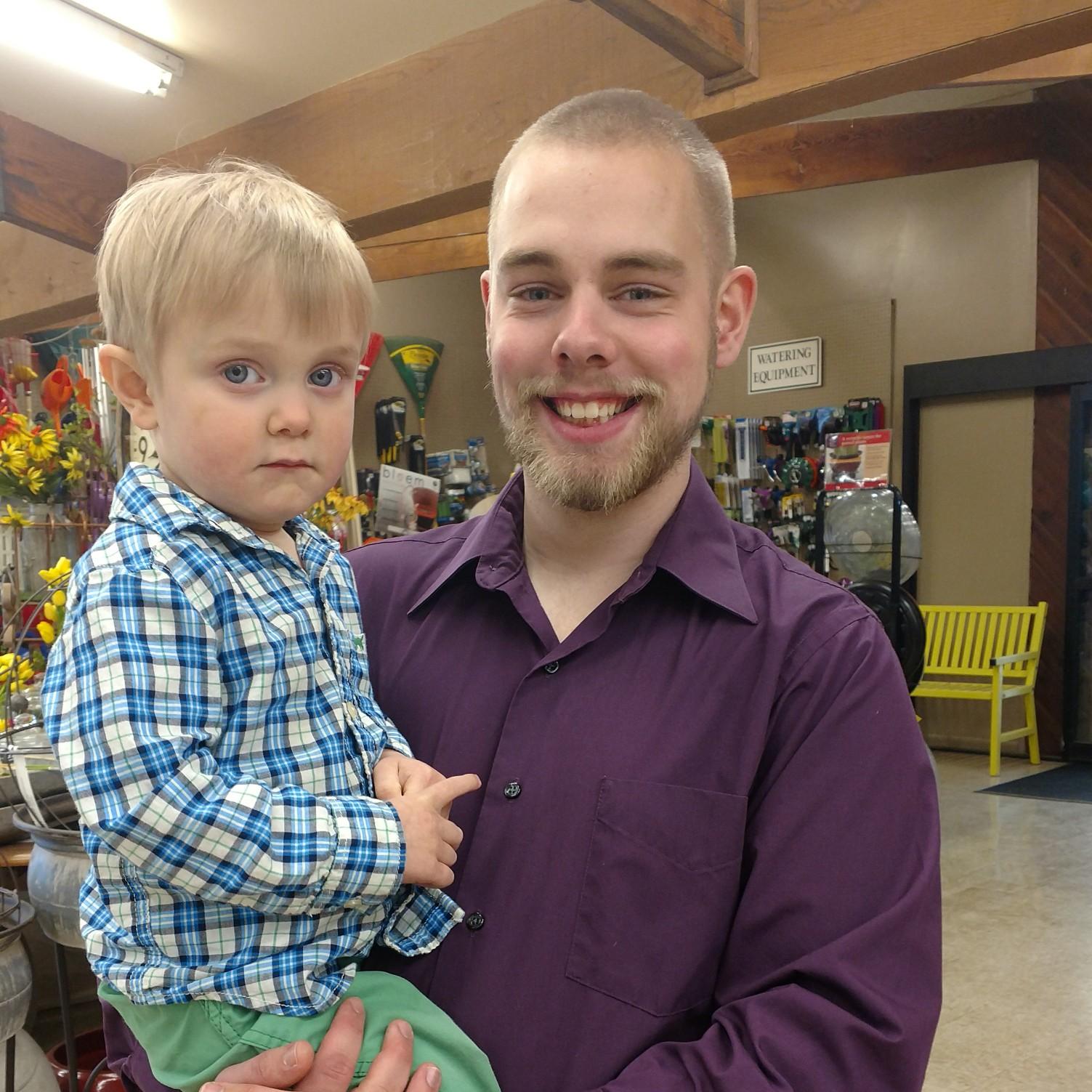 Aaron holding his nephew, Isaac, after his grandma's funeral.