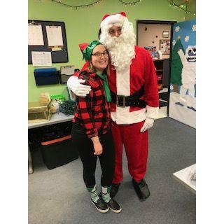 Cole dressed like Santa at my daycare Christmas party, and I was his Elf helper