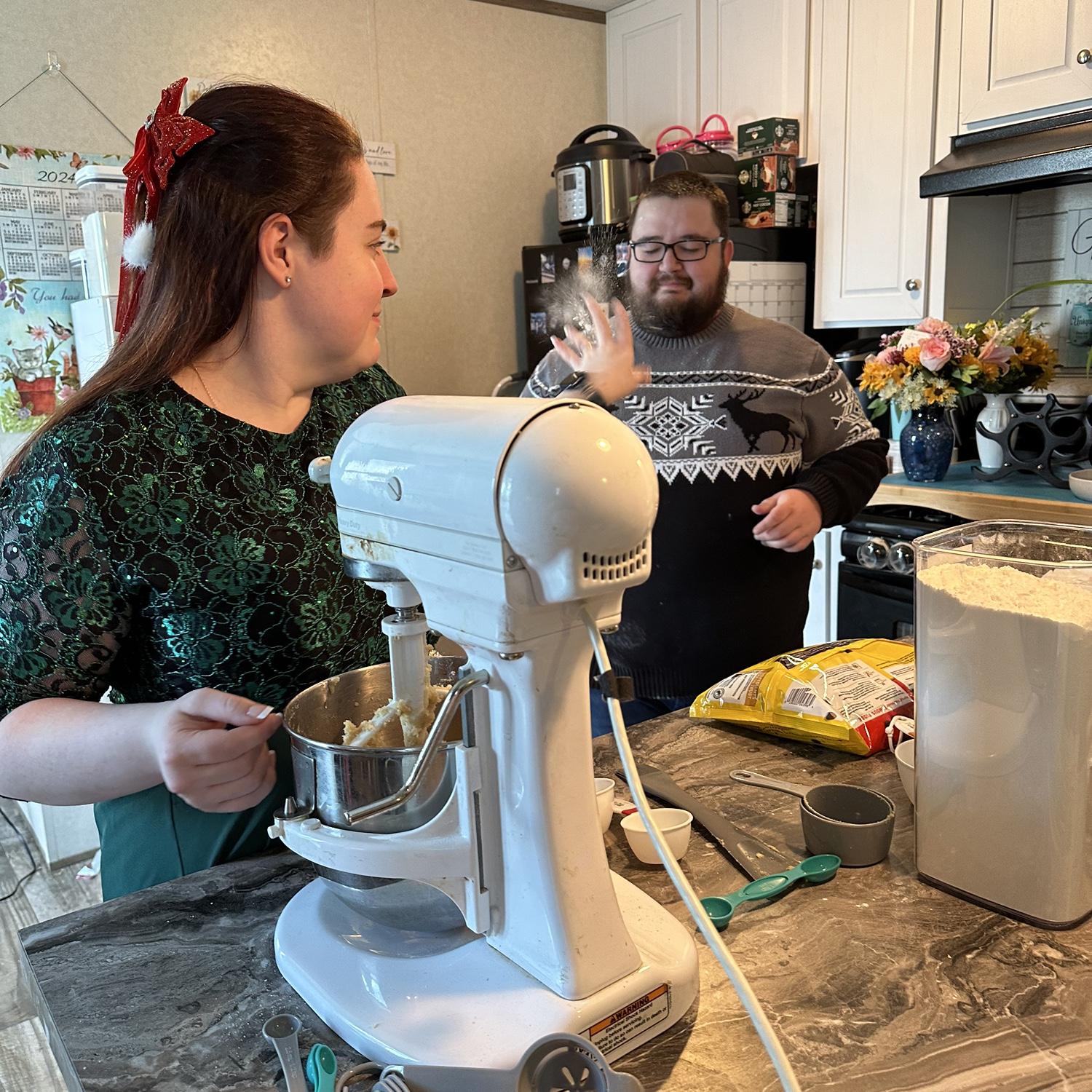 Candid (mostly) engagement photos while making Christmas cookies and a little flour snow