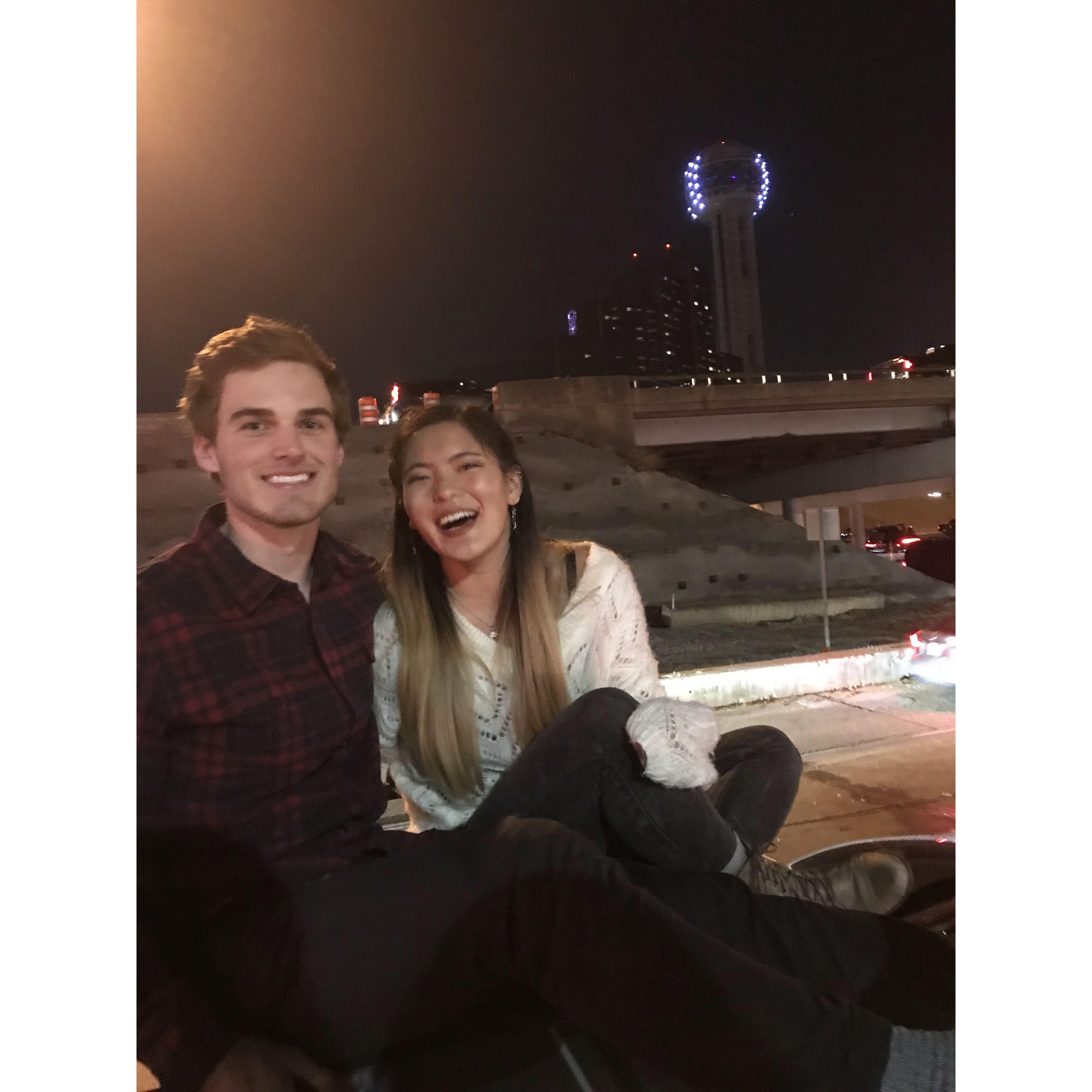 Watching the fireworks for New Years Eve 2018 in downtown Dallas... right after Ross's car got a flat tire
