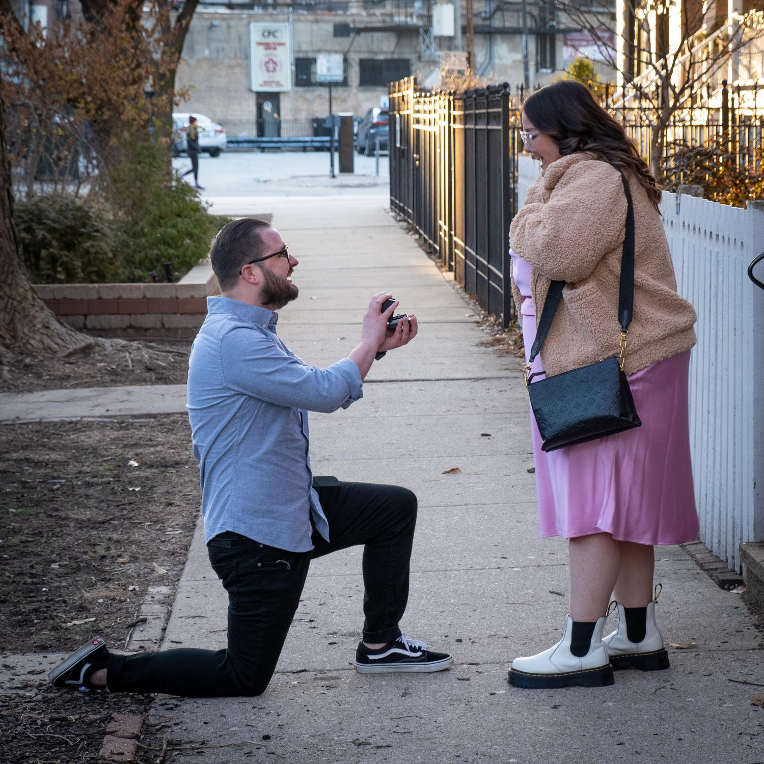 proposal outside Taylor's first apartment in the city where the two quarantined and taught from home together at the beginning of their relationship.