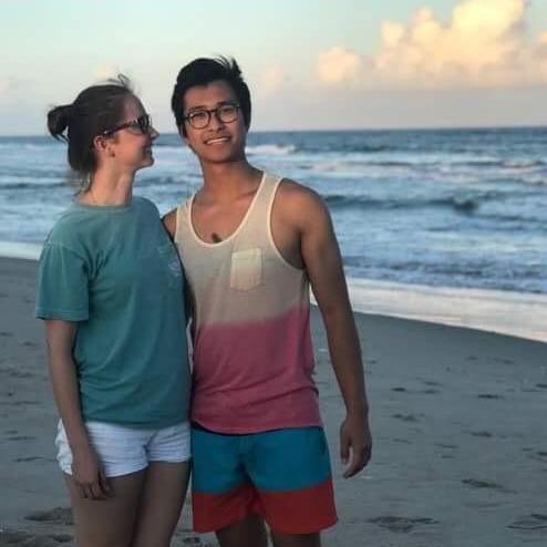She's actually thinking "this man is gonna lose his tank top in the ocean." I did lose my tank top. It's somewhere in the Atlantic ocean. If you find it, please bring it to the wedding!