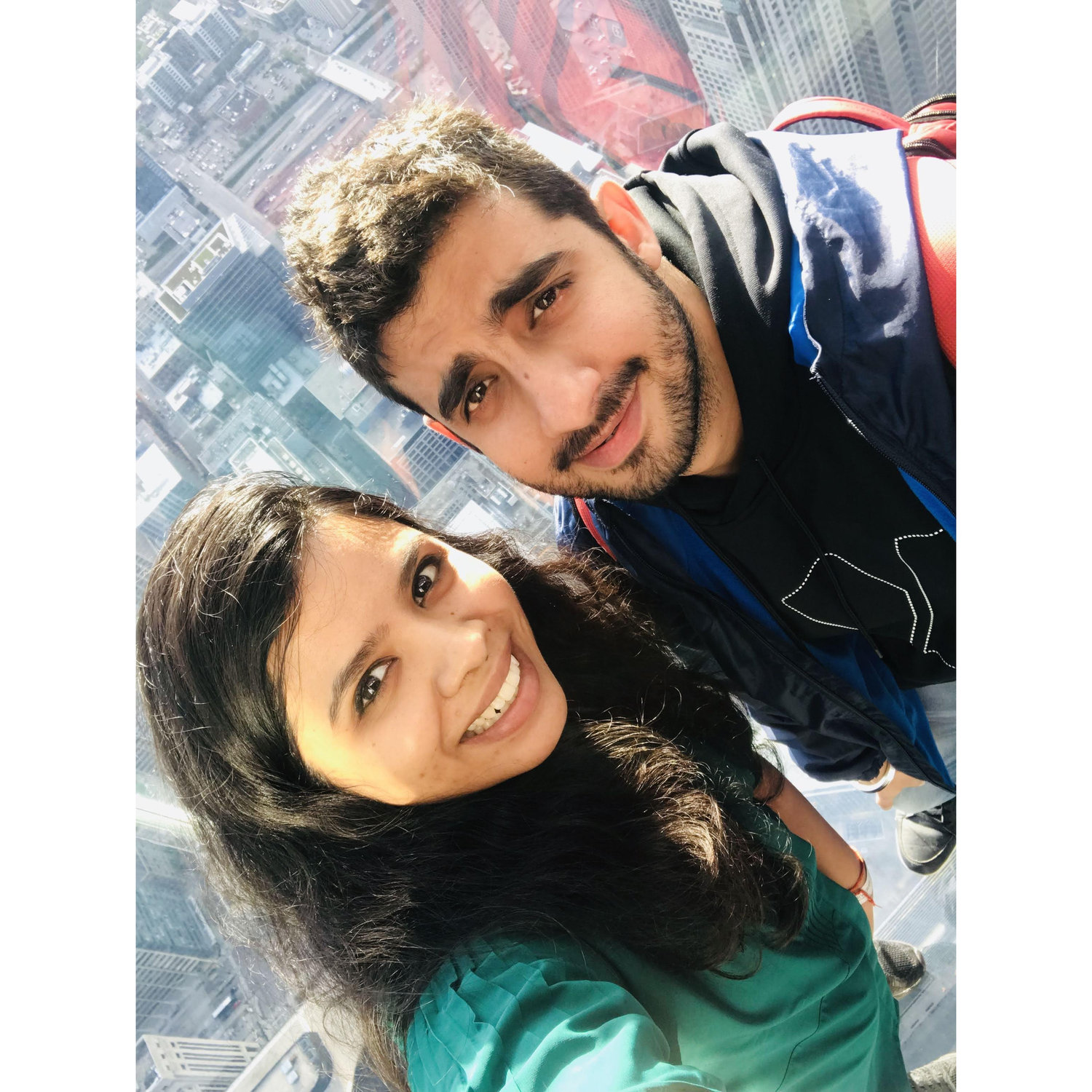 When we were too high in the air (close to 1,450 feet and 110 stories) to smile without being scared! :D