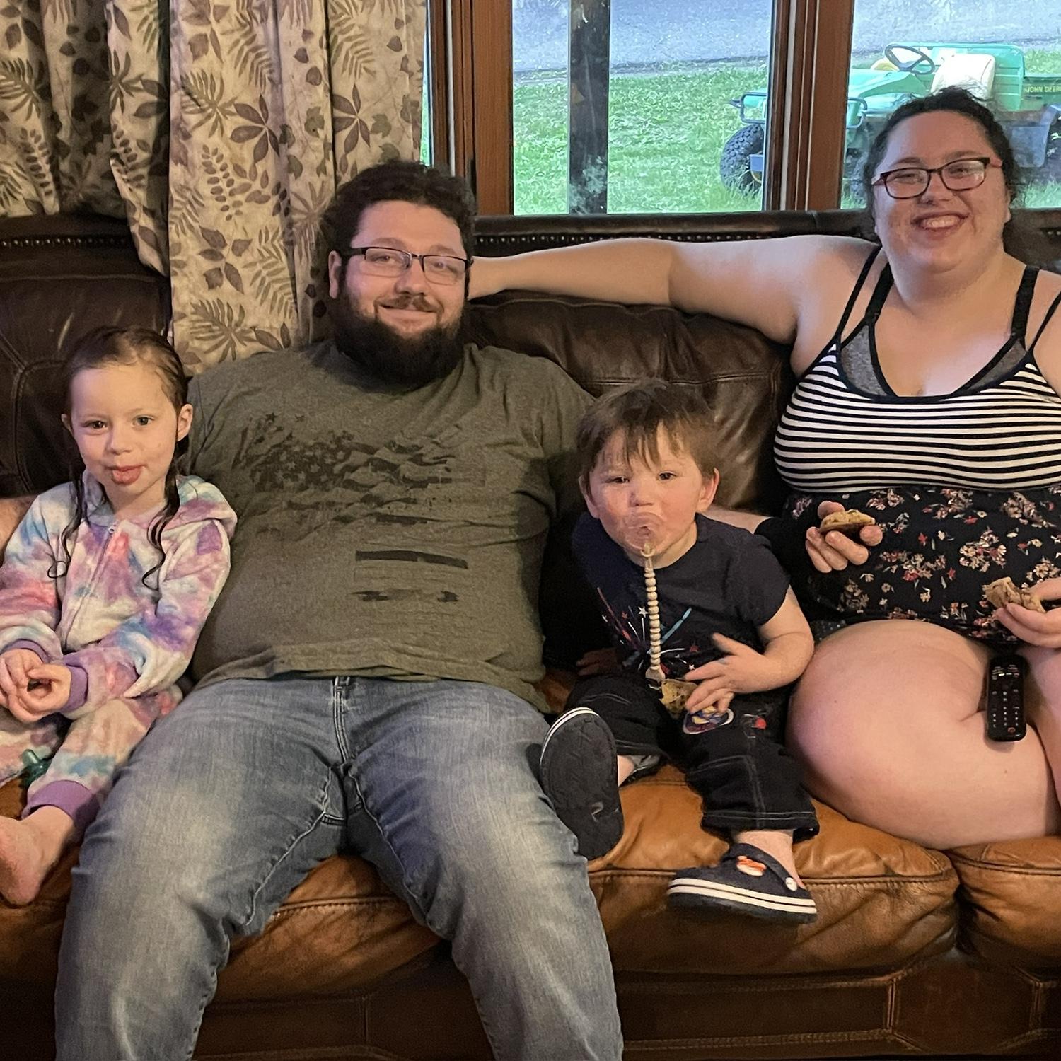 After a day at the splash pad, my mom made her special homemade cookies. She thought we looked cute sitting all together. So she took our family picture.