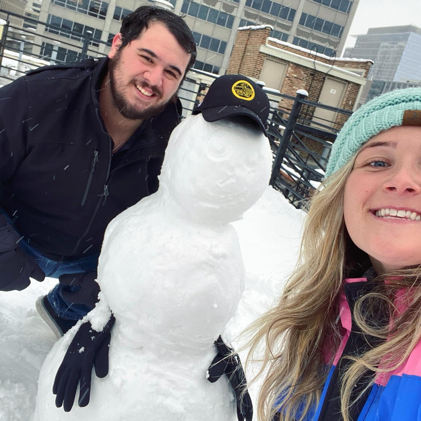 Nicole miraculously convinced Rychie to build a snowman together on the deck of their first apartment.