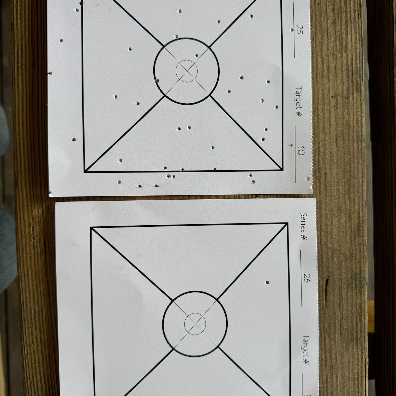 Darren's target vs. Ashleigh's target.
Technically speaking, she still hit the paper.