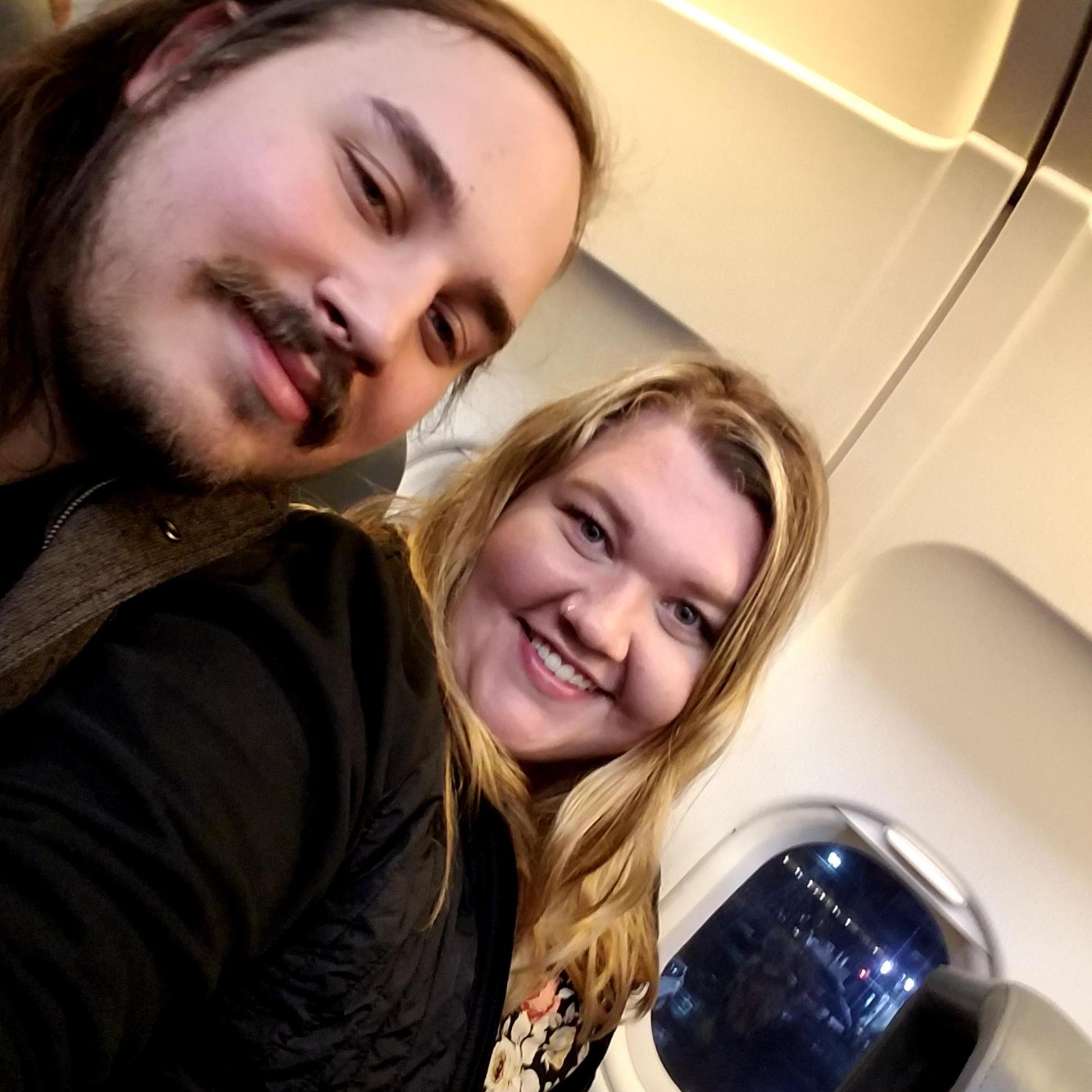 My first plane ride ever! He held my hand while I tried to keep calm!