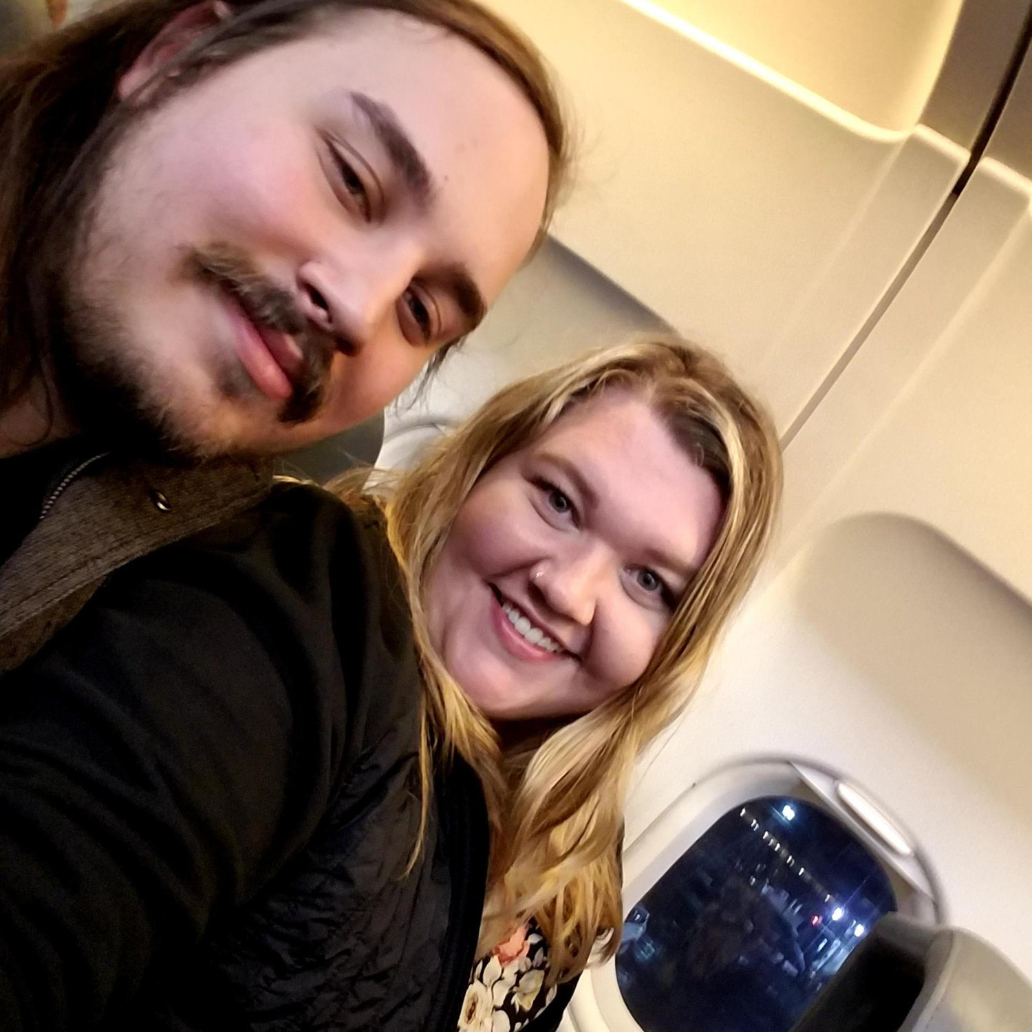 My first plane ride ever! He held my hand while I tried to keep calm!