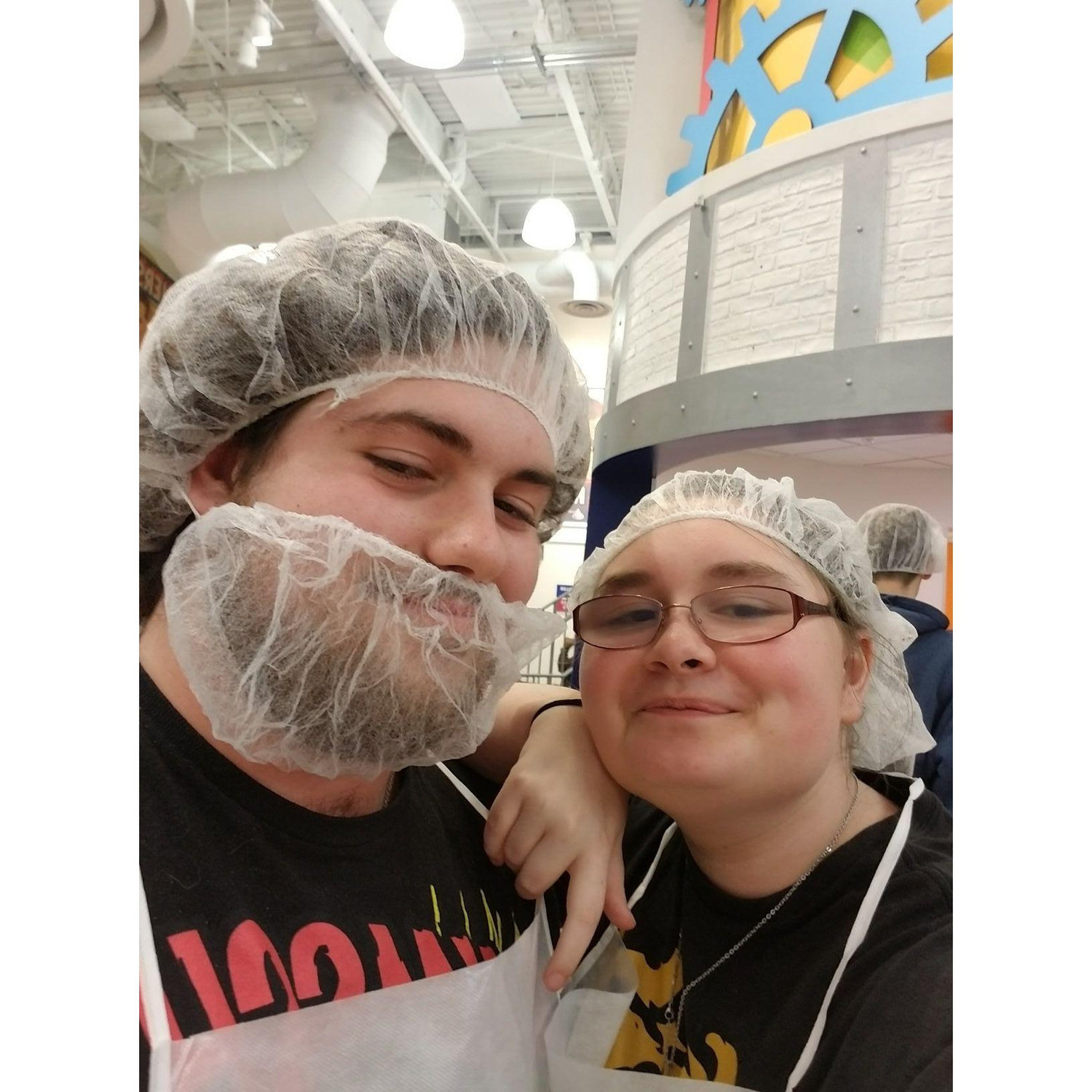 Connor and Claire getting ready to make chocolate bars at Hershey World.