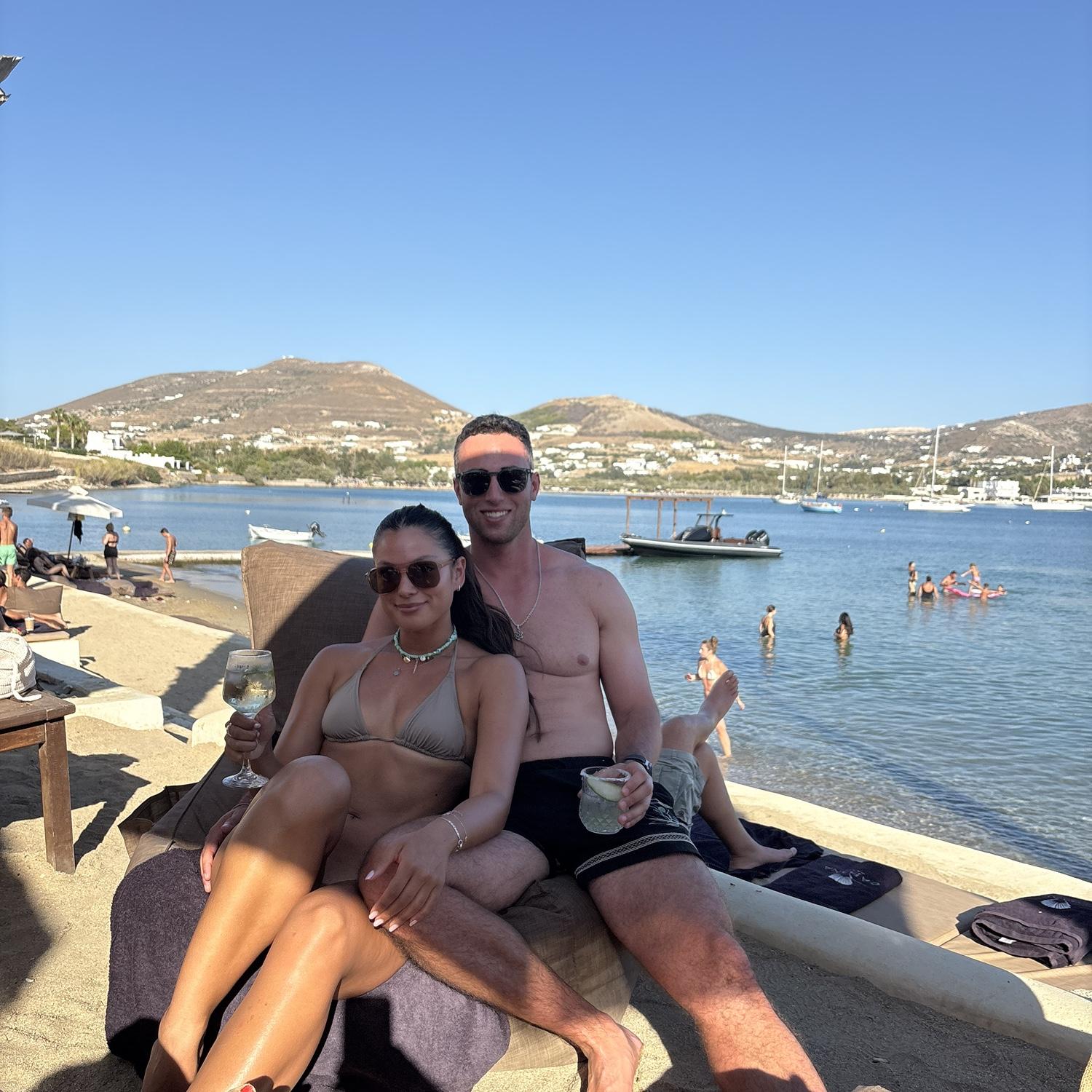 Ali and Eric love a party on a beach. One of their many trips together.