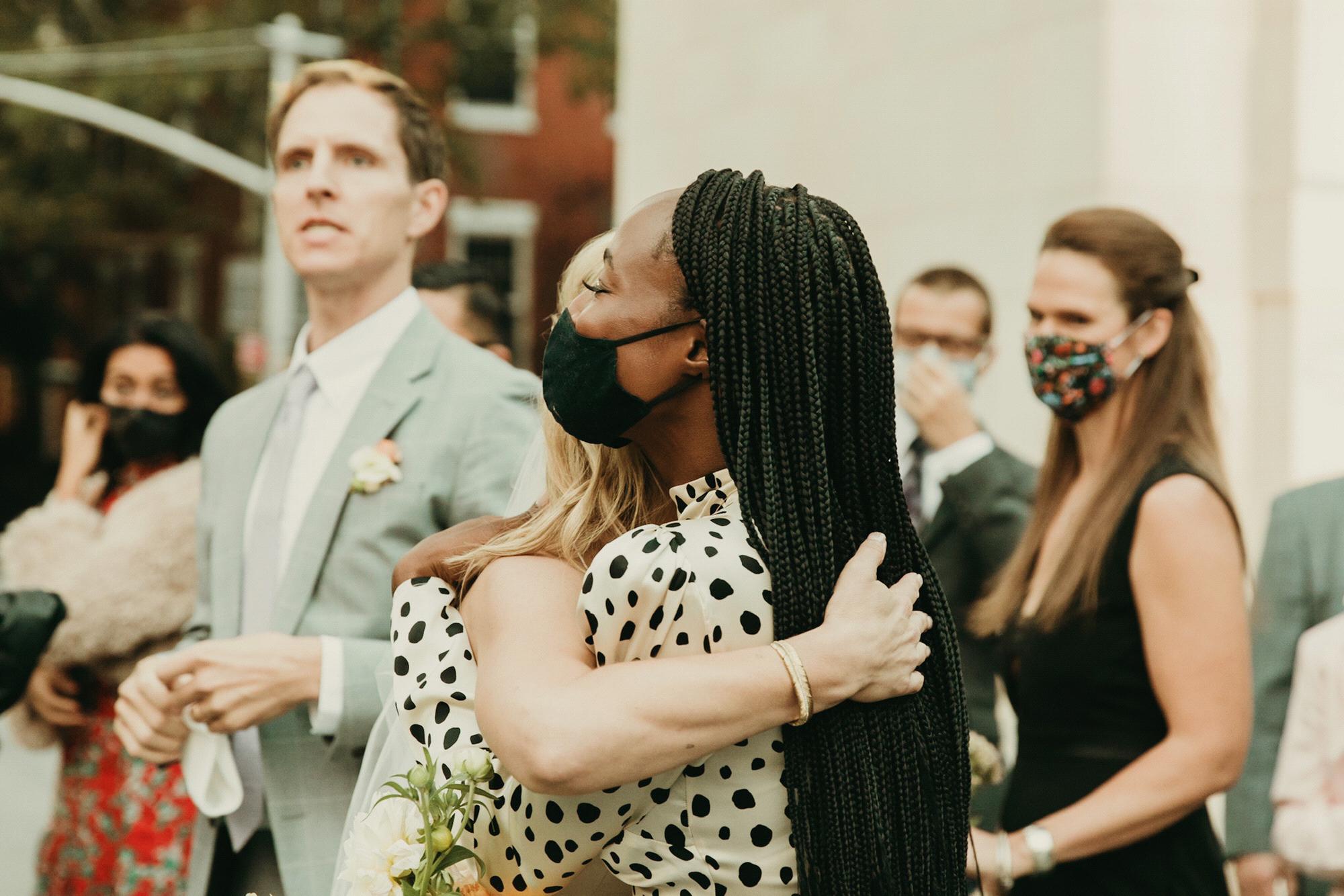 Rosebud hugs Sydnee Washington after the ceremony. Pic by @Purroy_photo_video