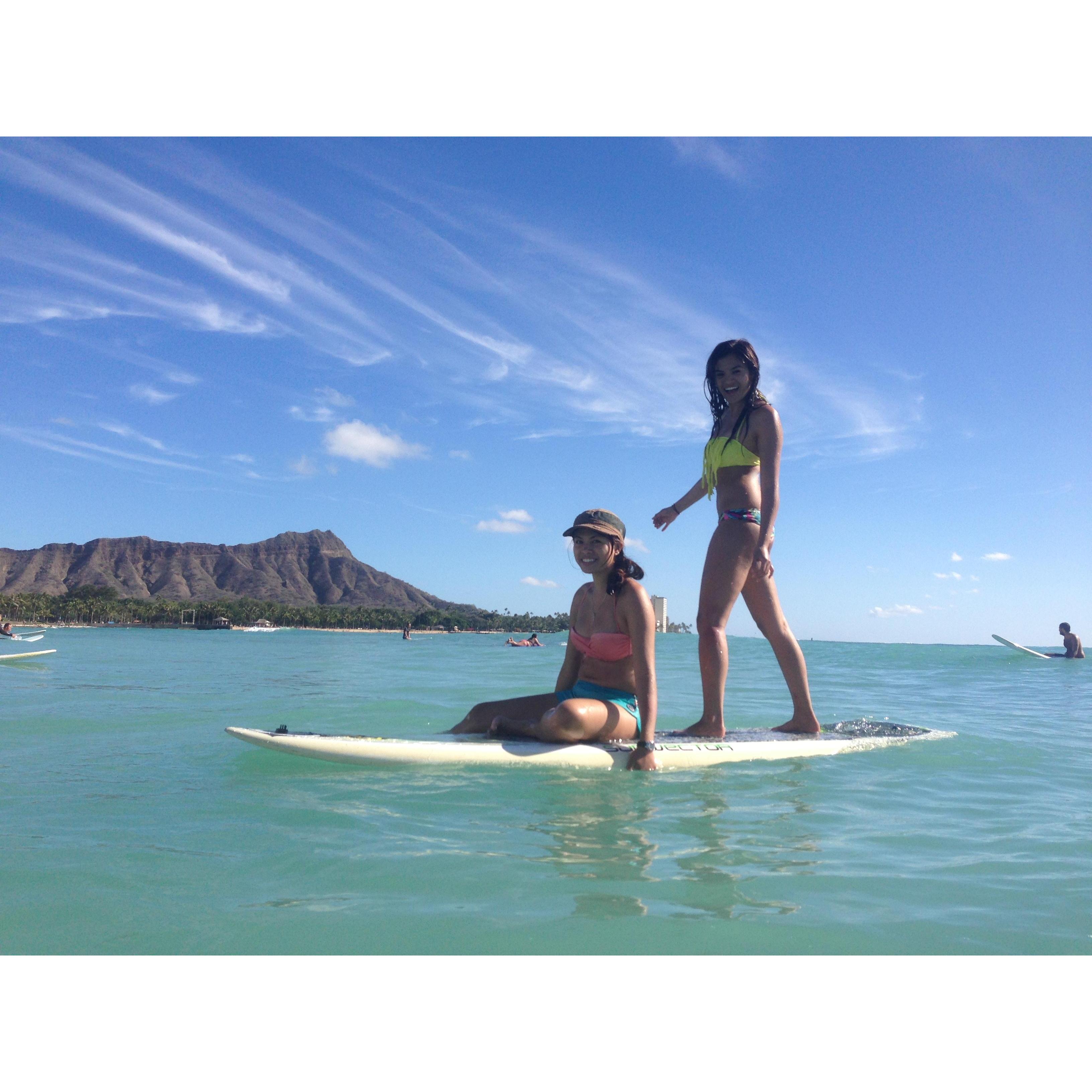 Amber and her sister Ally tandem surfing. Goofing around in between sets.