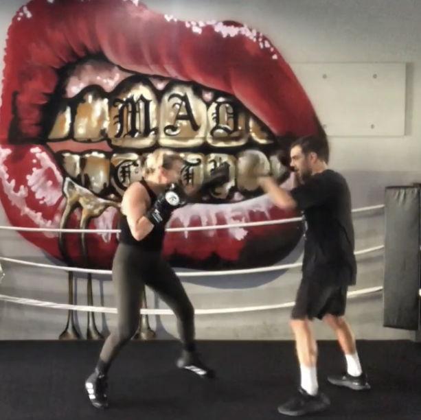 Becomig boxing coaches and friends. We would meet before class and practice our mitt work.