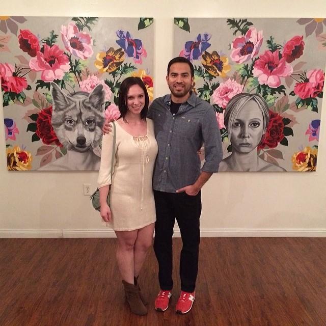 In front of Katherine's paintings at one of her shows.
